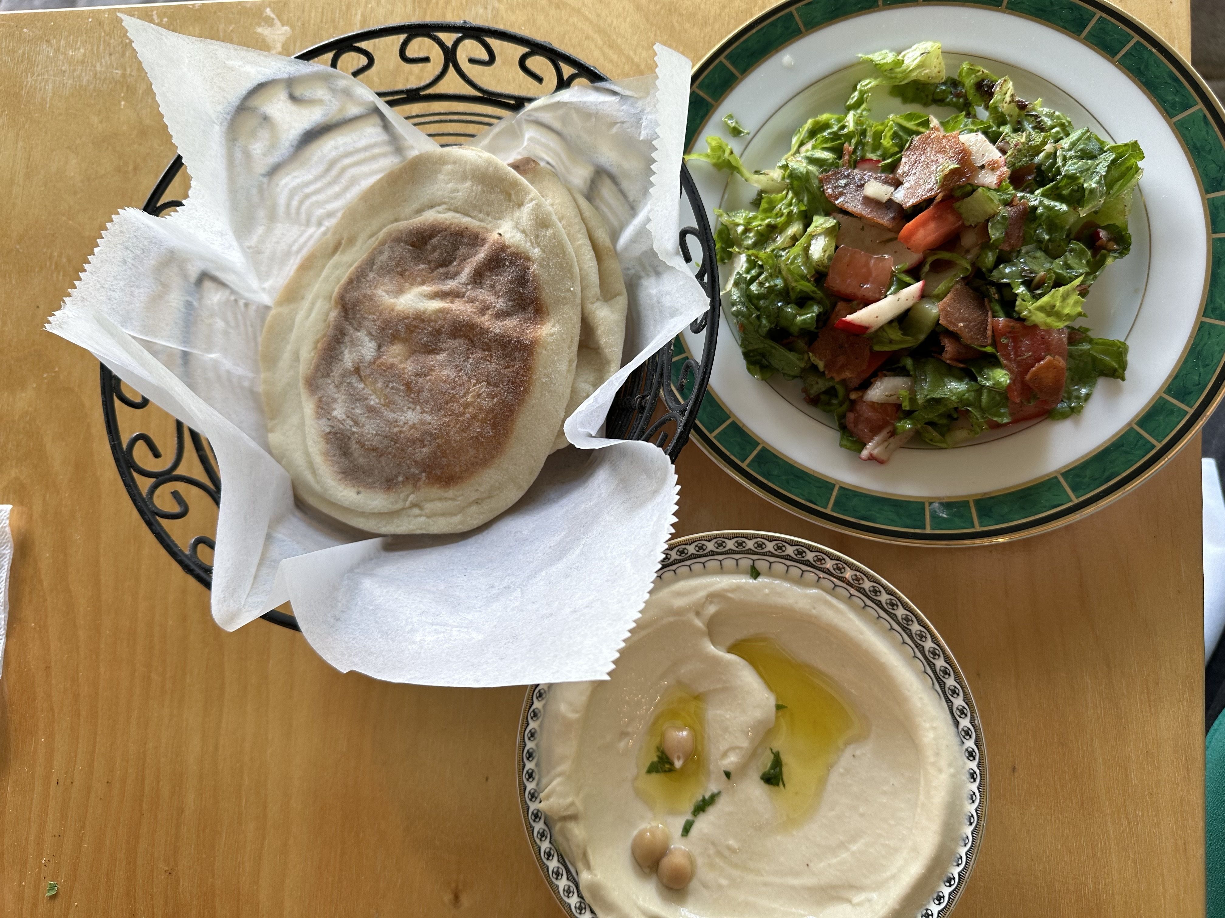 photo of pita, salad and hummus