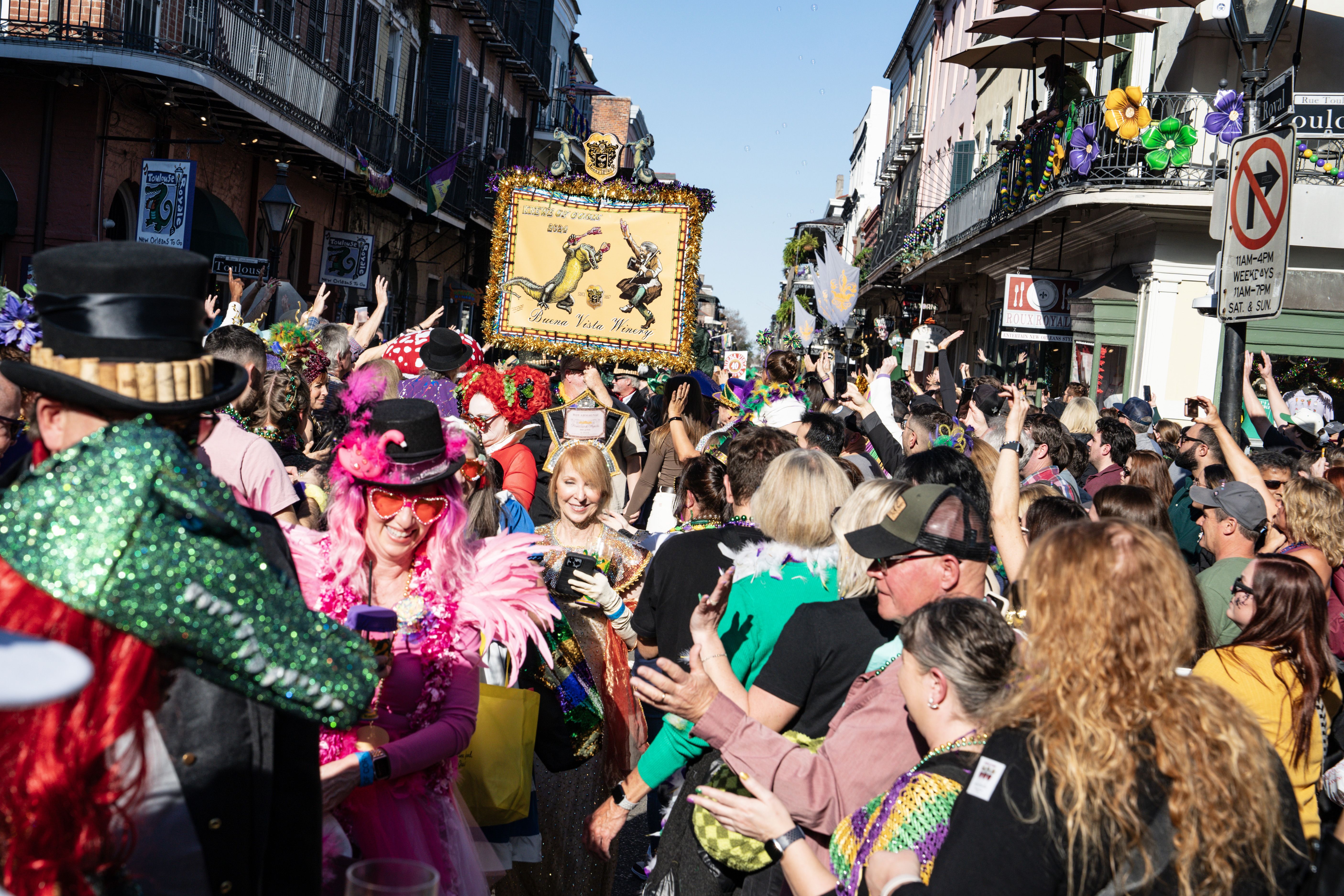 A scene shot of the Krewe of Cork parading in the French Quarter.