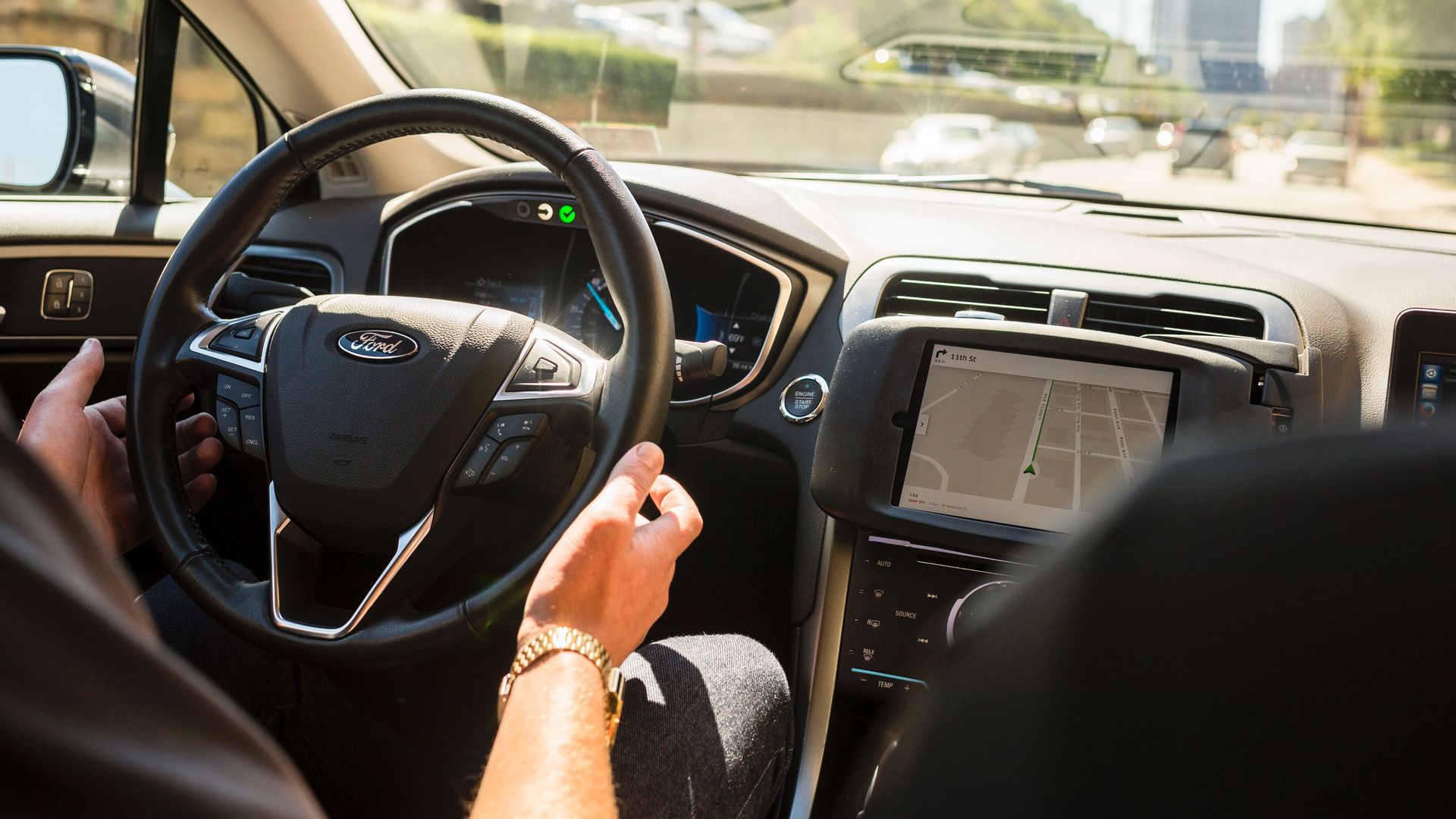 Image of driver with hands off the steering wheel