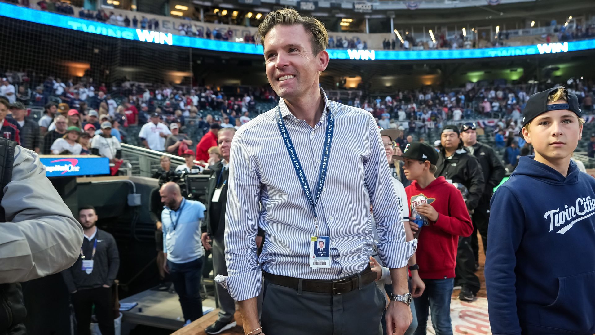 A photo of Joe Pohlad  standing at Target Field
