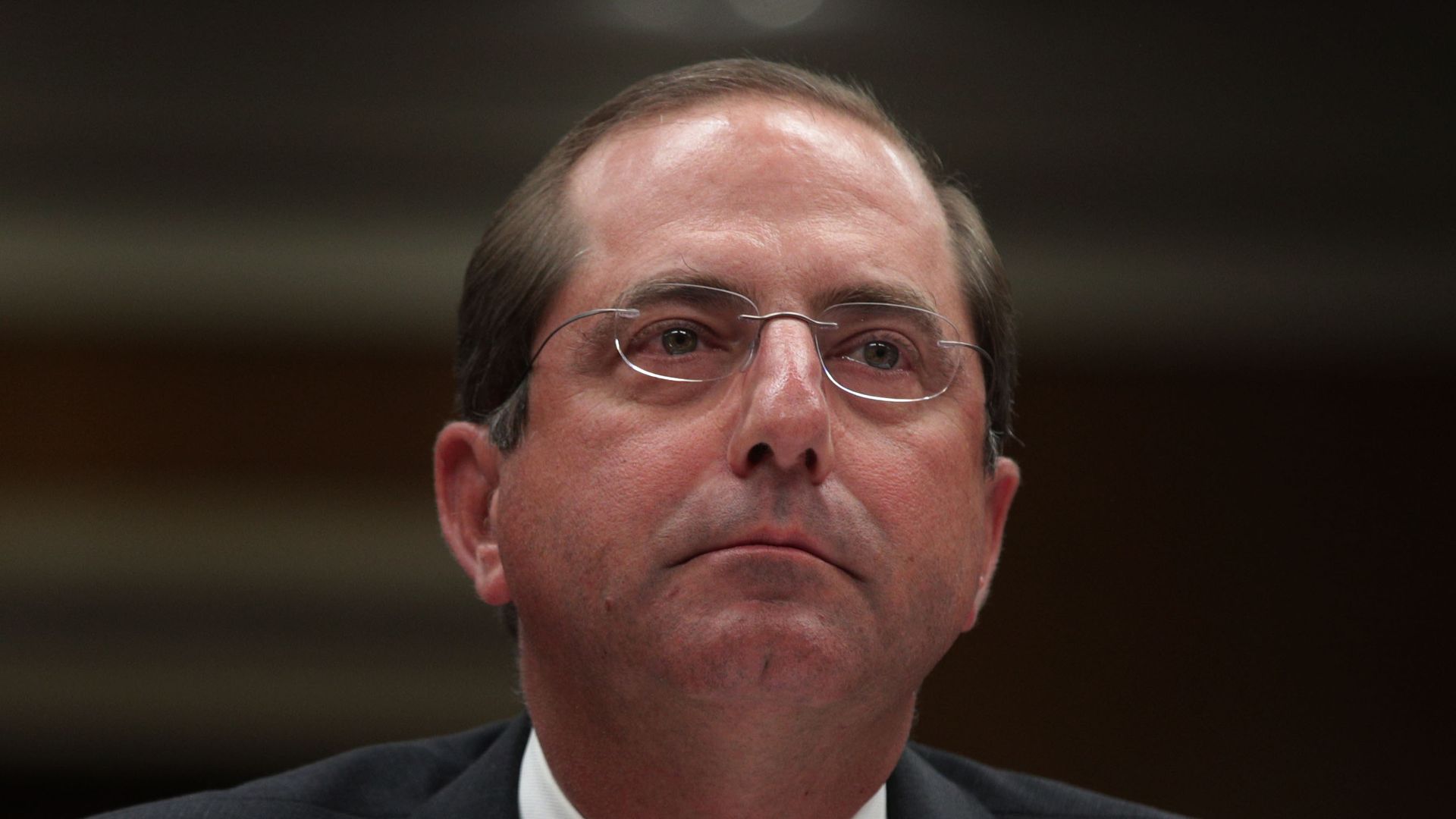 In this image, Alex looks ahead.