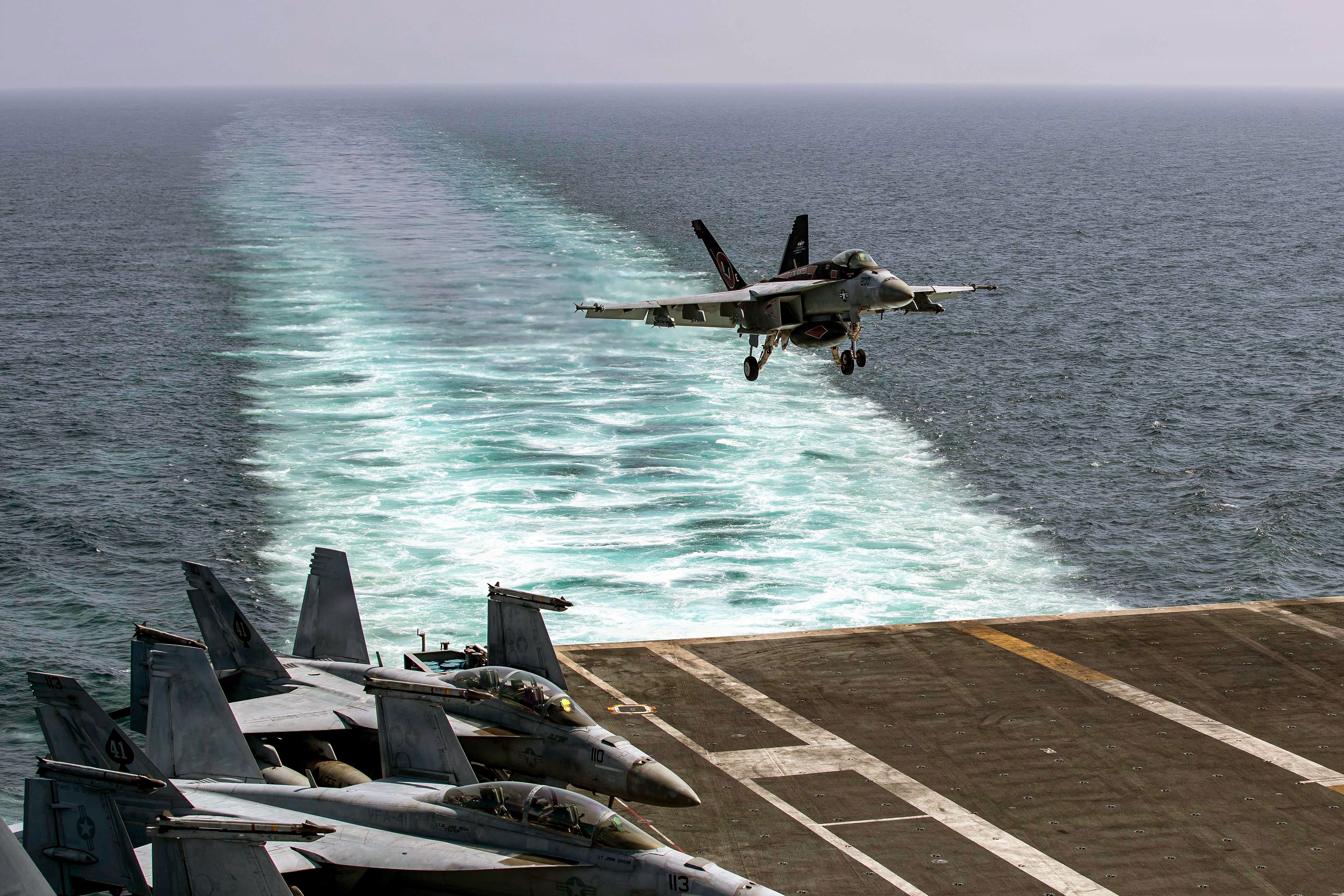 An F/A-18E Super Hornet returns to the USS Abraham Lincoln in support of Operation Epic Fury on Saturday.