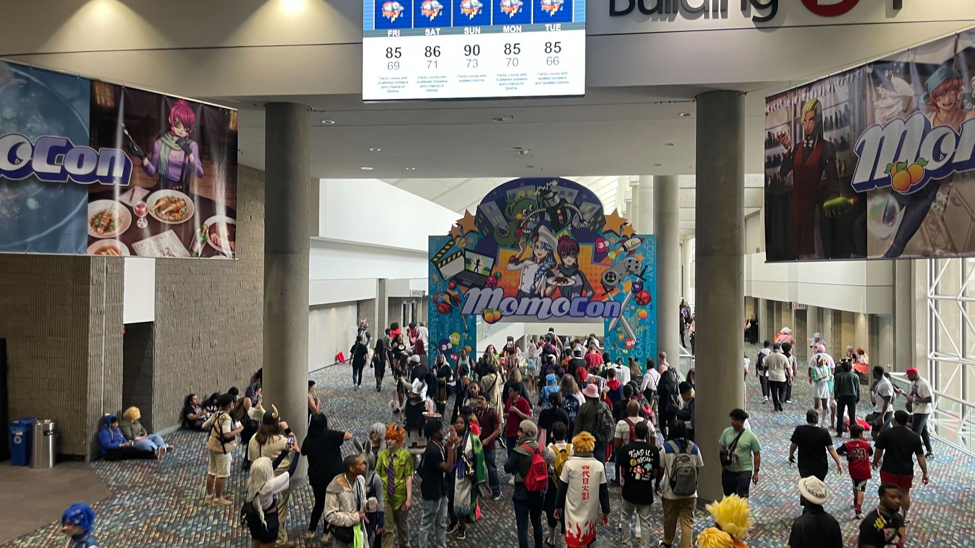 More than 30 people gather around the entrance to MomoCon at the Georgia World Congress Center.