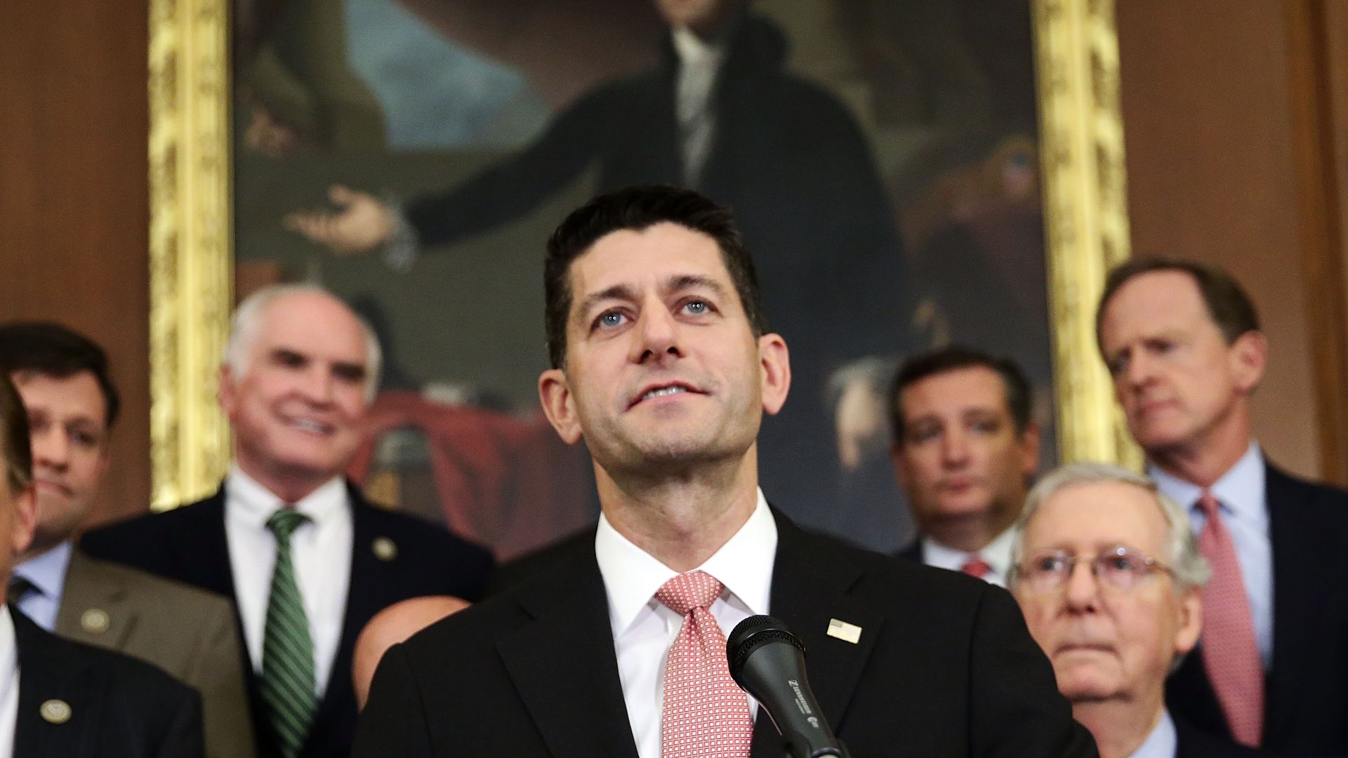 Paul Ryan smiles while standing in front of other leaders of the GOP 