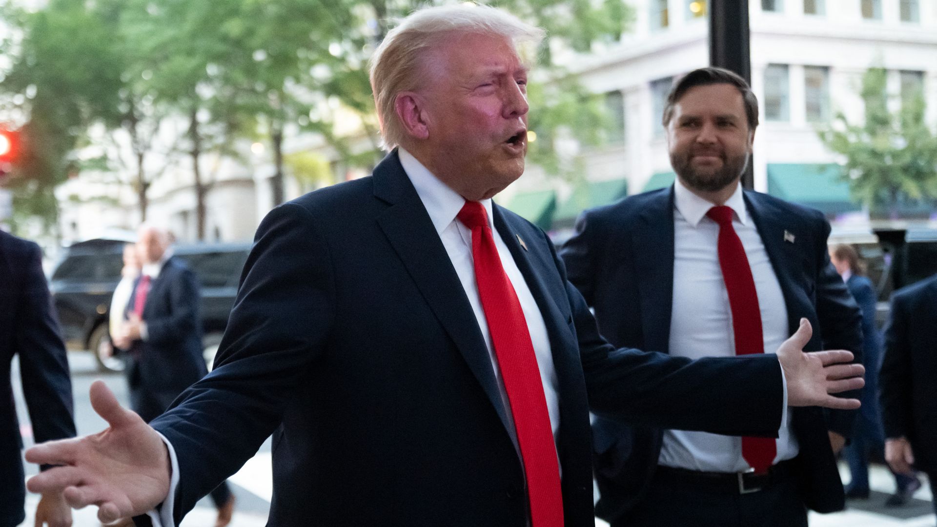 President Trump speaks outside Joe's Seafood in Washington with Vice President Vance at his side.
