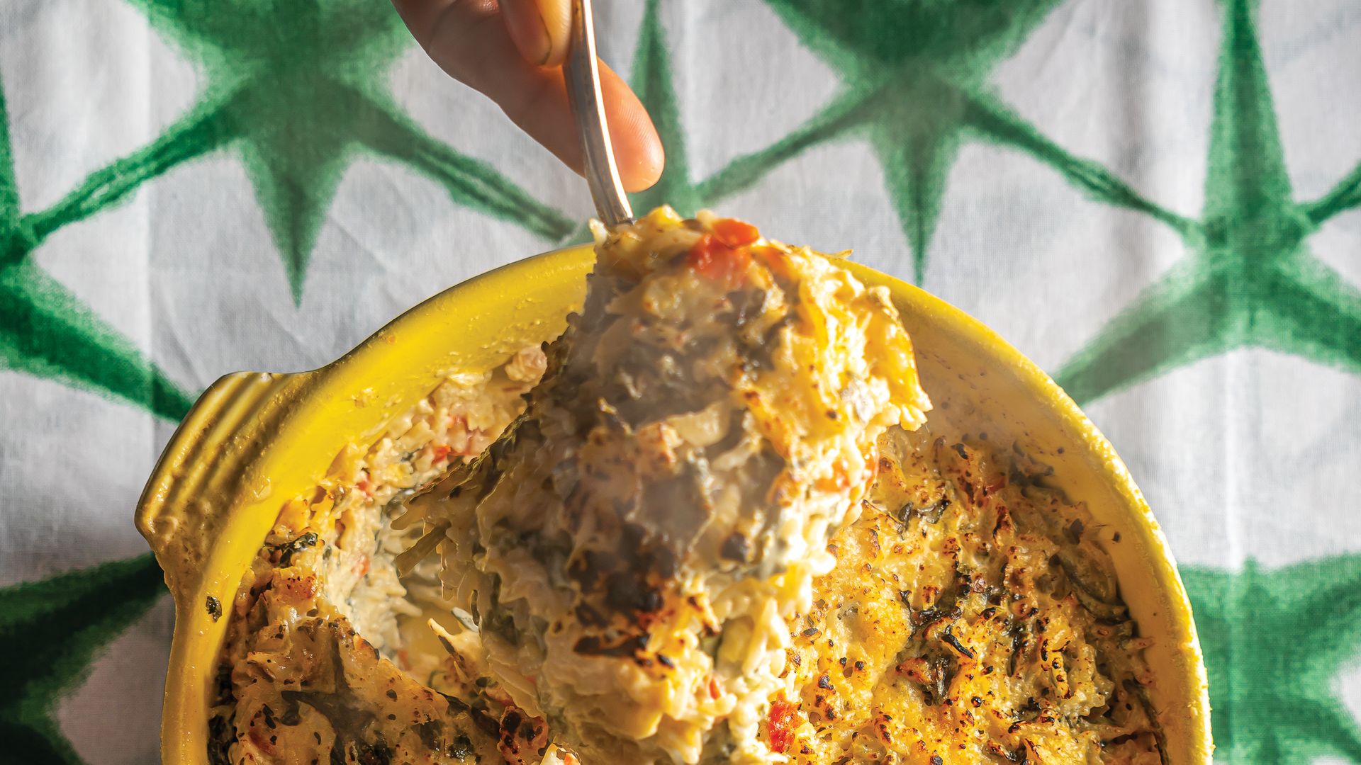 hand spooning spinach rice dip