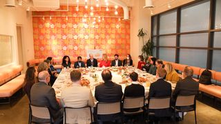 Participants enjoyed breakfast during the discussion.