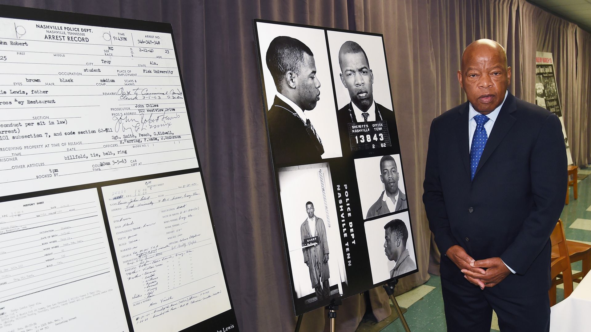 Rep. John Lewis views for the first time images and his arrest record for leading a nonviolent sit-in at Nashville's segreated lunch counters, March 5, 1963. 