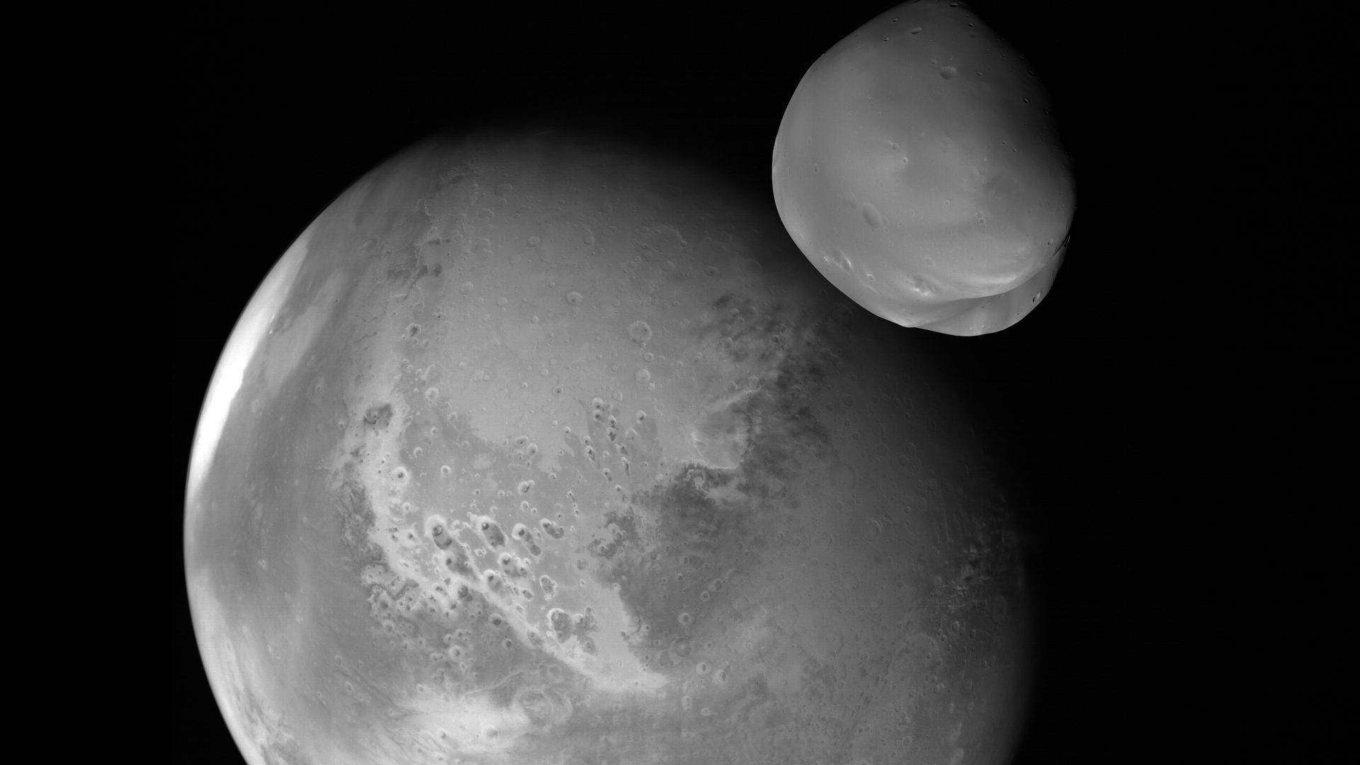 Deimos and Mars seen in black and white by the Hope probe
