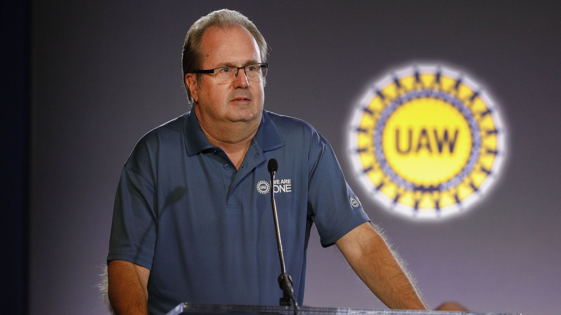 Gary Jones stands at a podium.