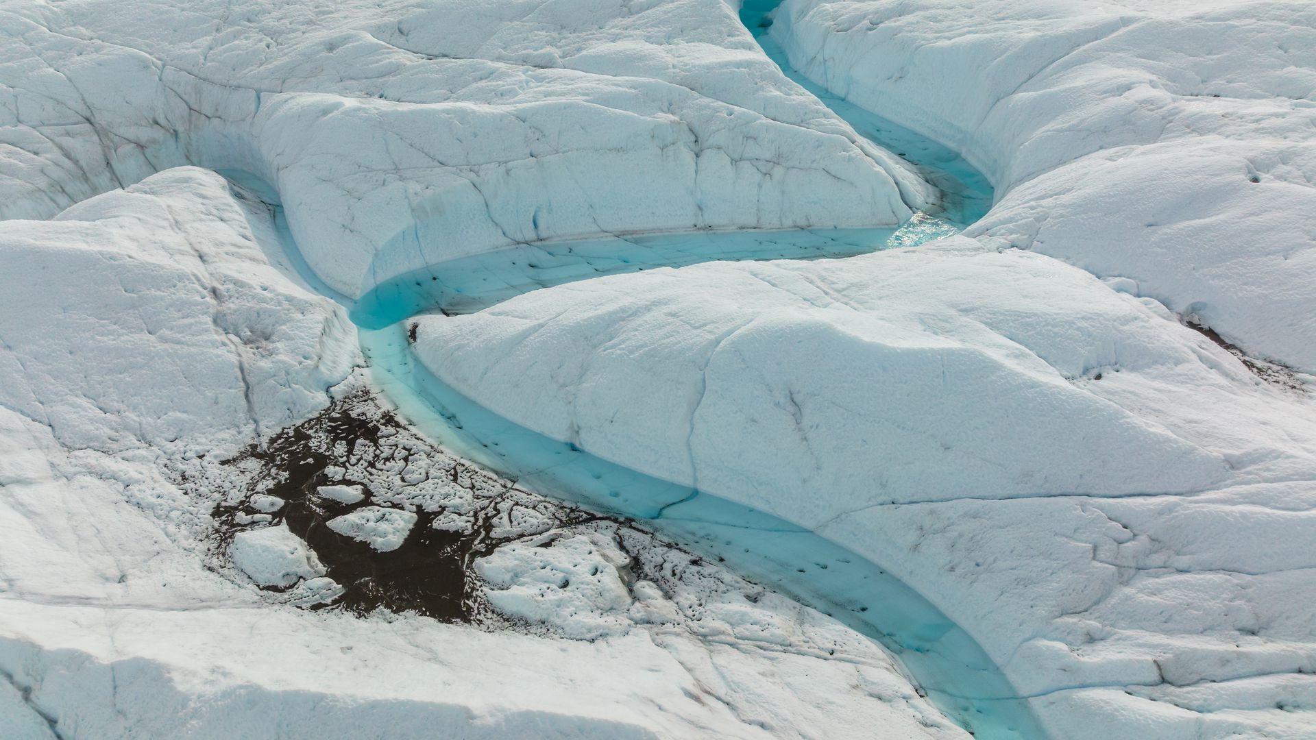 An aerial view of meltwater on the Russell Glacier in Greenland on Aug. 16, 2022. Photo: Lukasz Larsson Warzecha/Getty Images