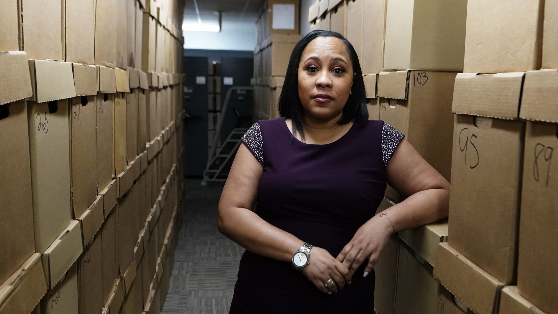 Fani Willis in a hallway with boxes of documents