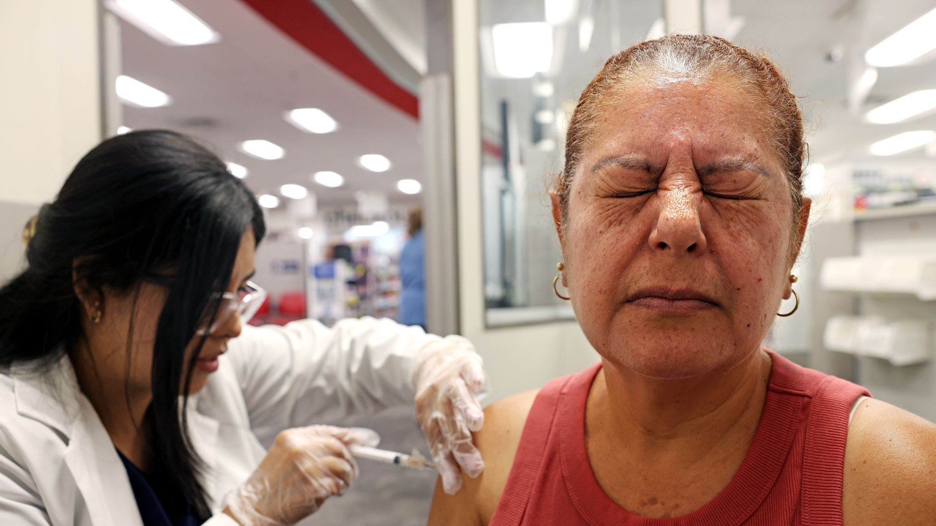 A woman gets a flu vaccine.