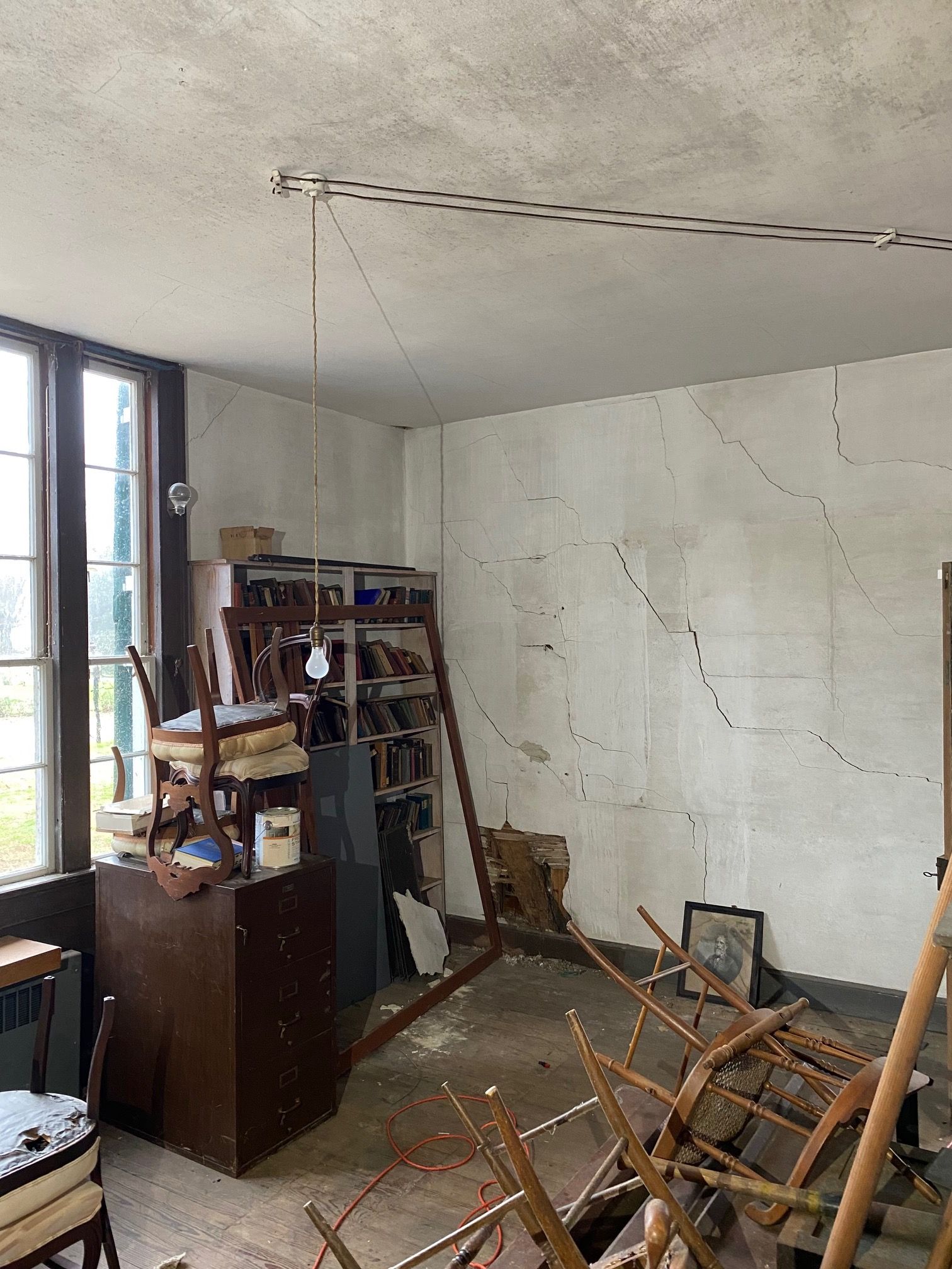 The old filing cabinet in the room where a copy of the U.S. Constitution was found surrounded by strewn, broken old chairs.
