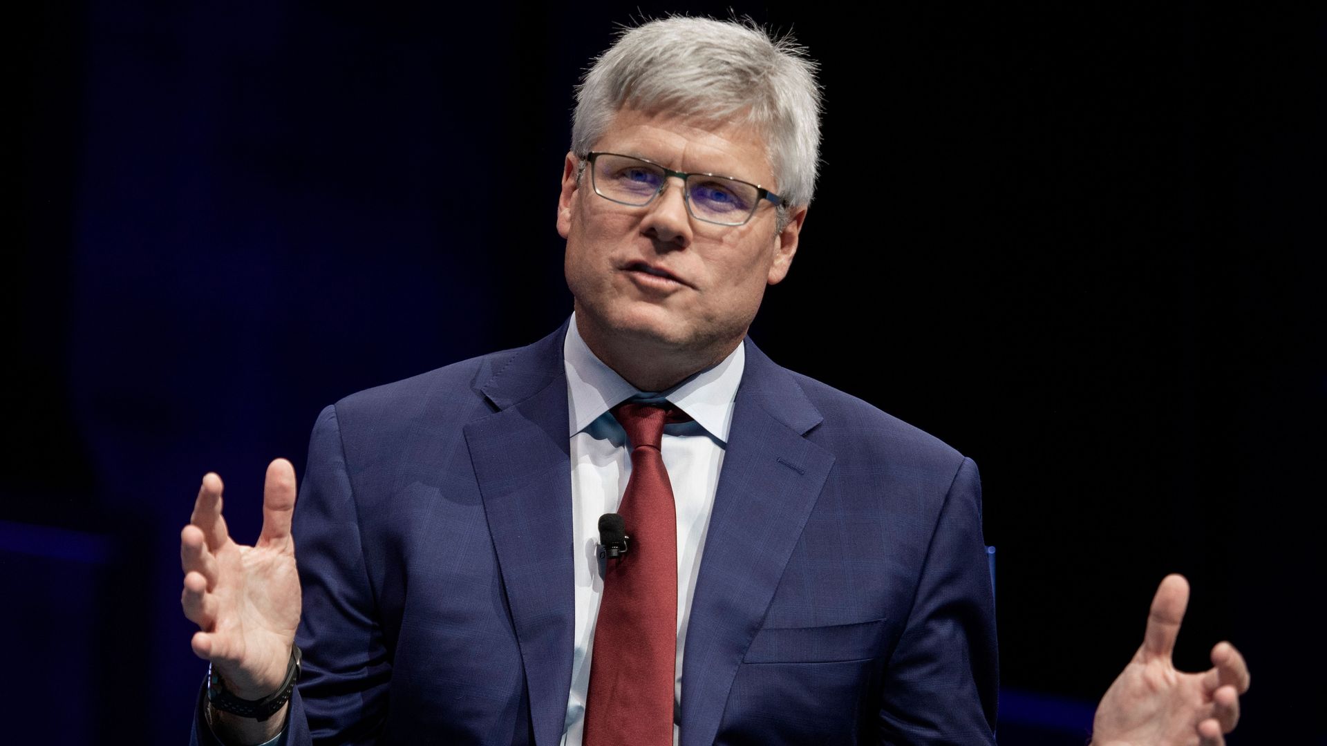 Qualcomm CEO Steve Mollenkopf speaking at a business roundtable