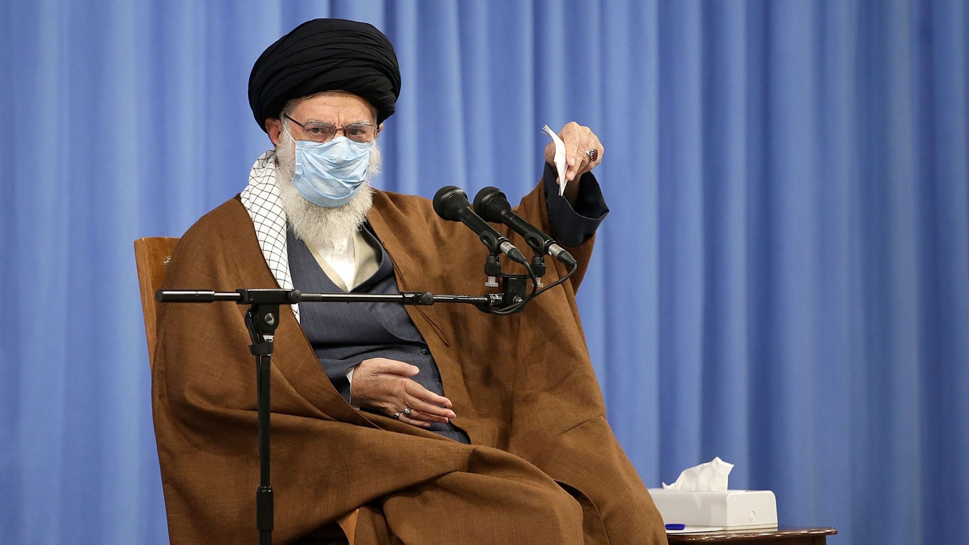 Picture of Iranian supreme leader Ayatollah Ali Khamanei speaking into a microphone