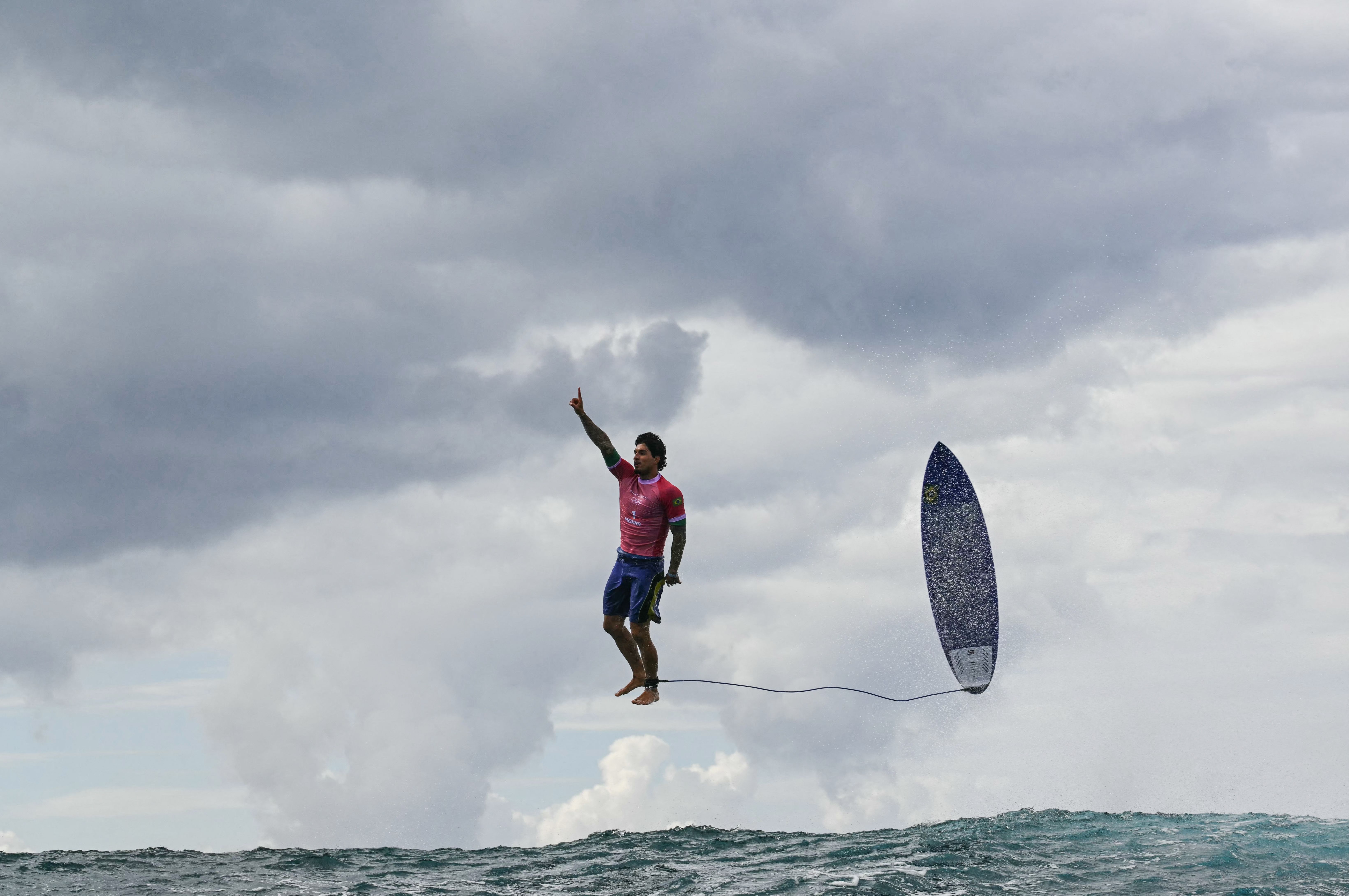 Brazil's Gabriel Medina reacts after getting a large wave in the 5th heat of the men's surfing round 3, during the Paris 2024 Olympic Games, in Teahupo'o, on the French Polynesian Island of Tahiti,