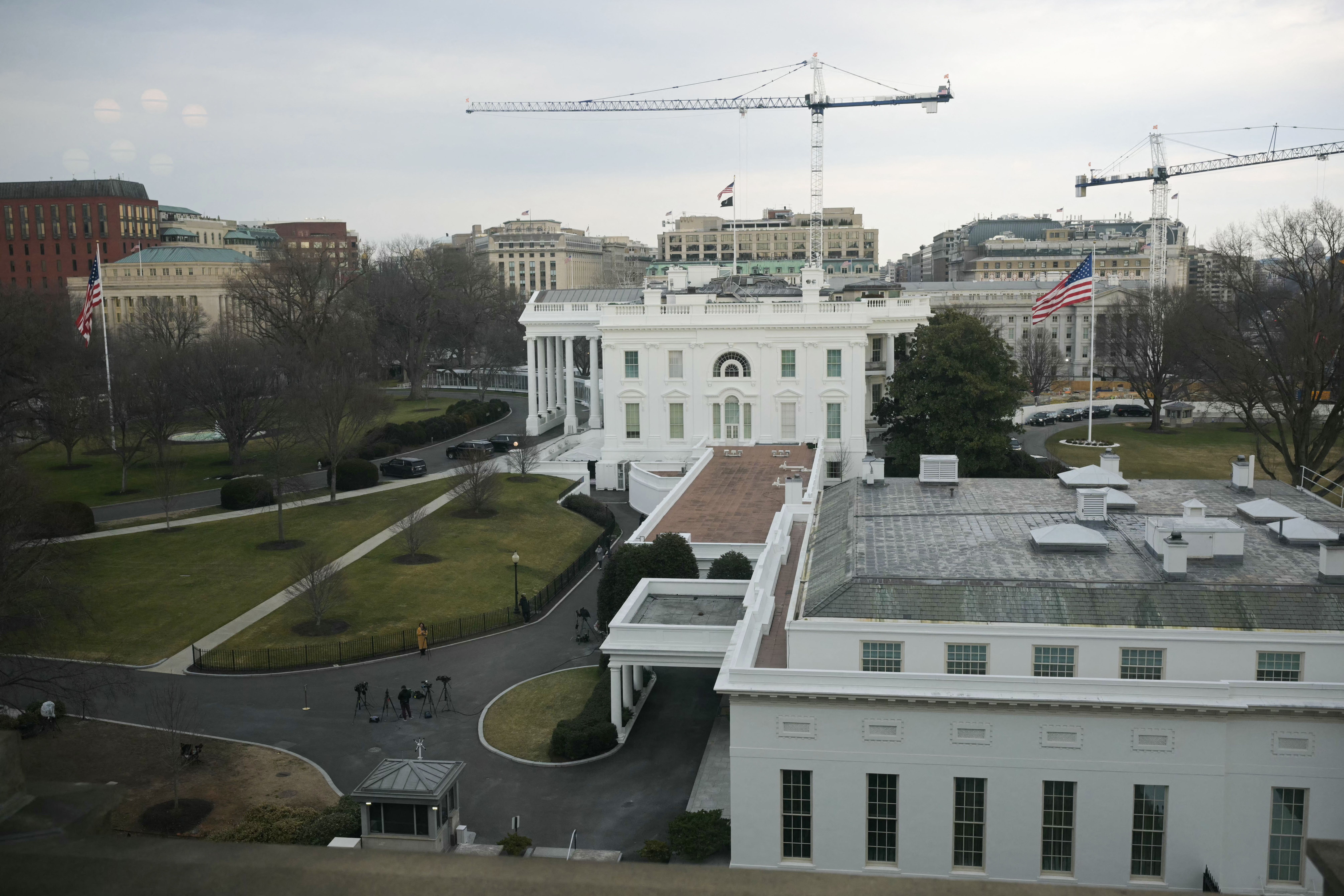 Construction cranes on the White House grounds in Washington, D.C., where a new ballroom is being built.