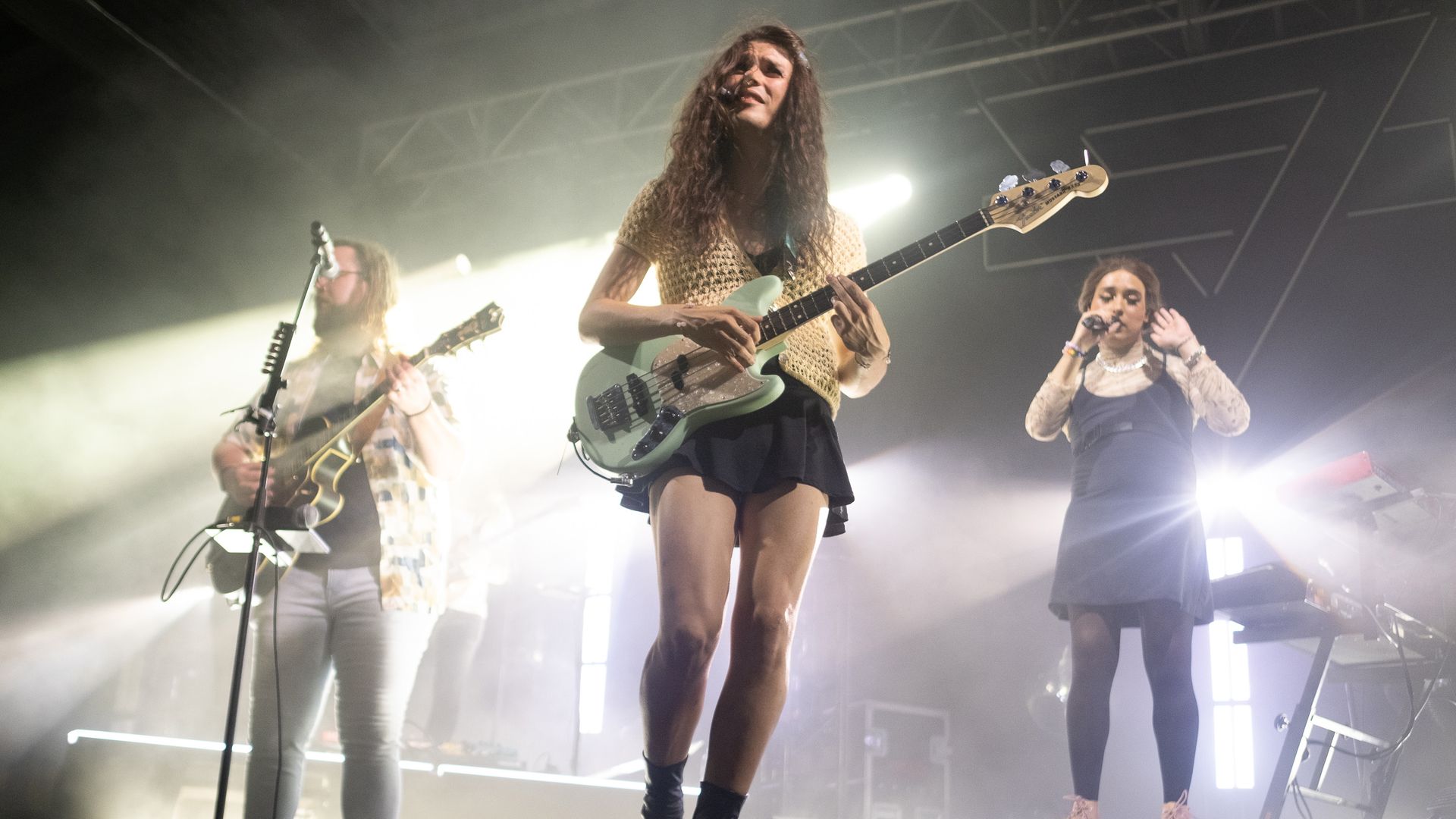 three people play music