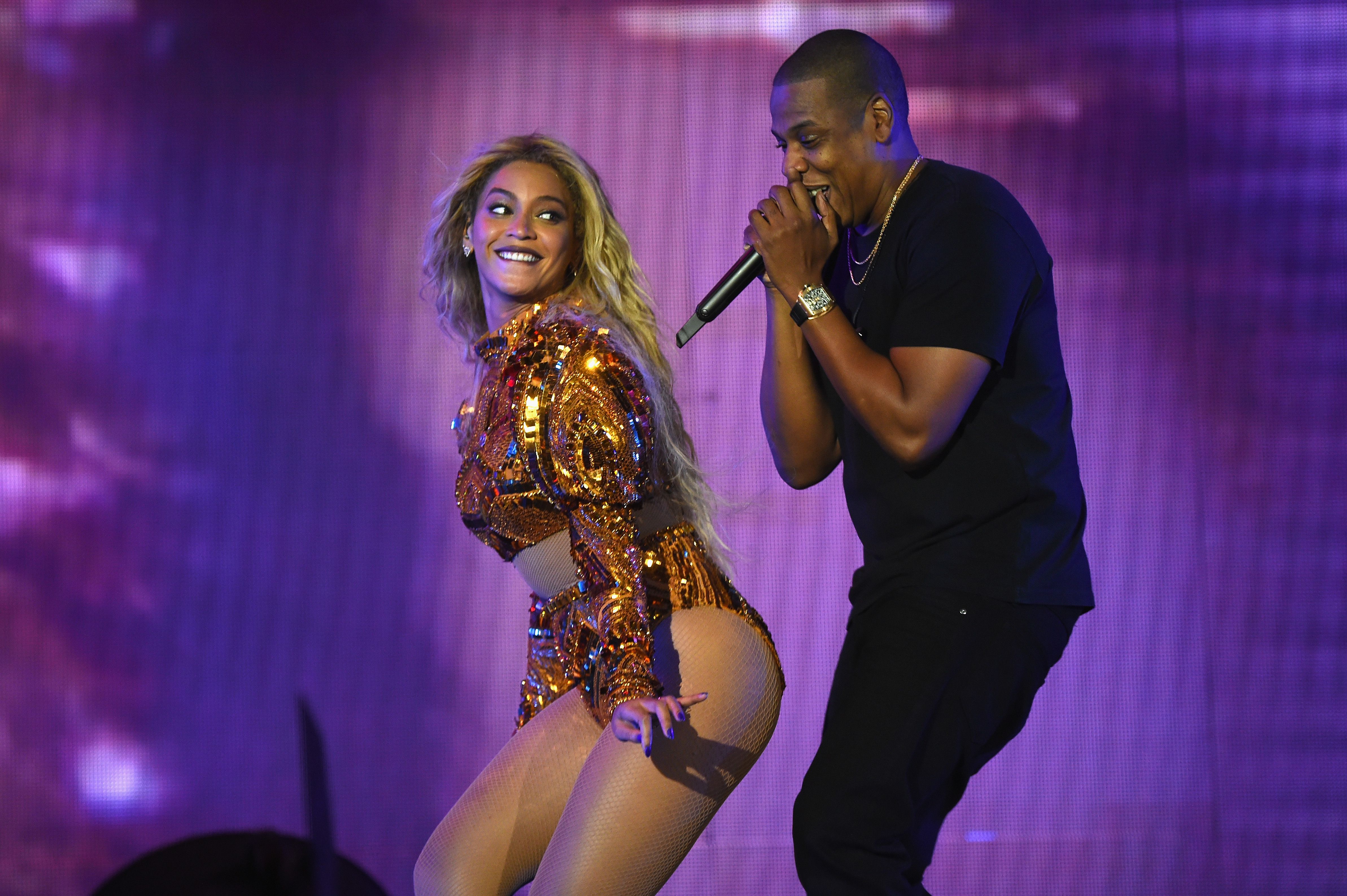 Photo shows Beyonce and Jay-Z performing on stage together in 2016.