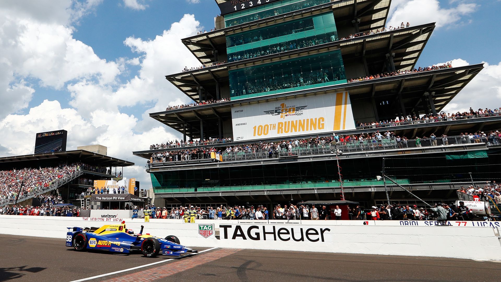  Alexander Rossi of the United States pumps his fist as he crosses the finish line to win the 100th running of the Indianapolis 500 at Indianapolis Motorspeedway on May 29, 2016 in Indianapolis, Indiana. 