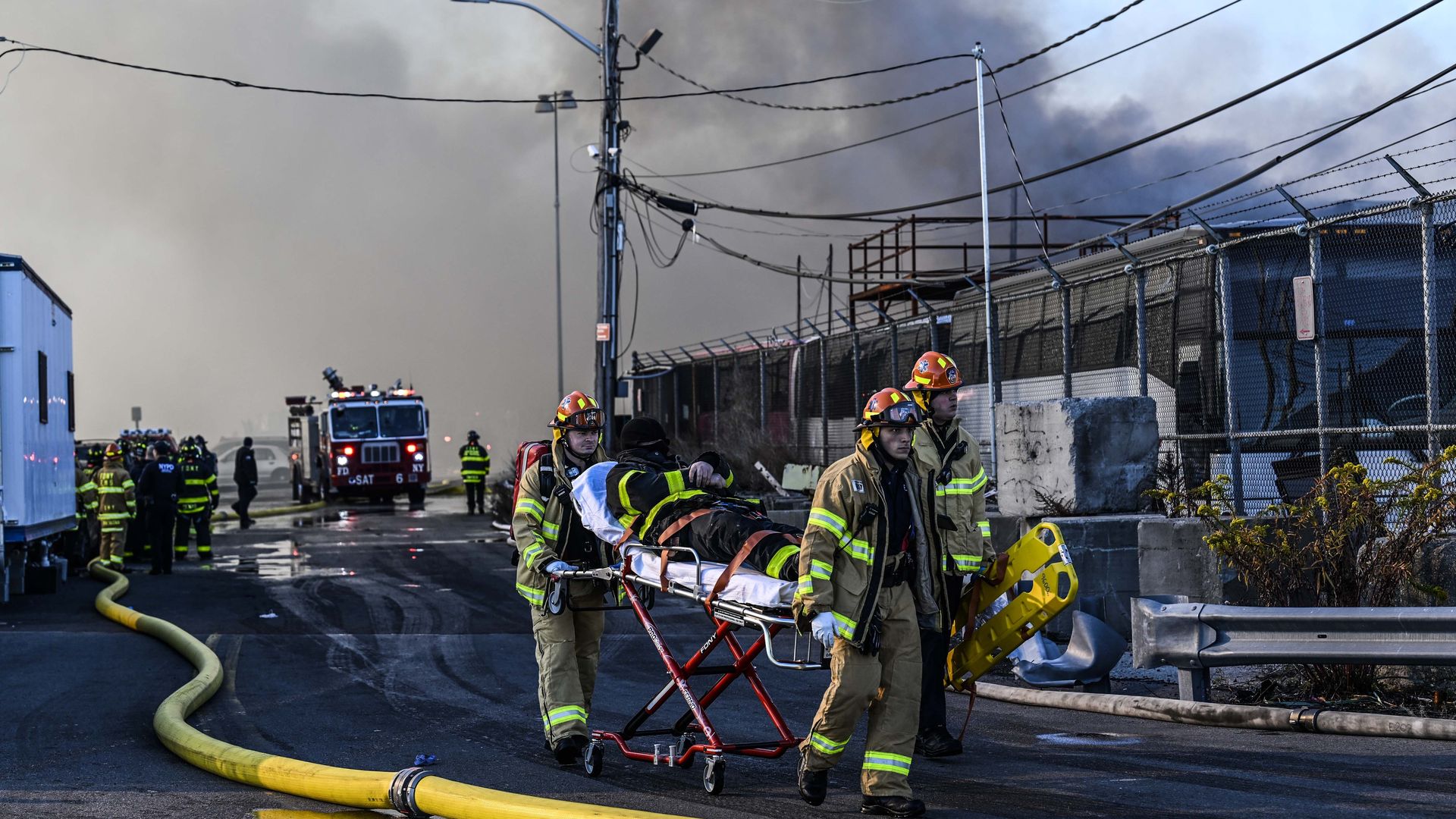 Firefighters responding to a massive fire at a New York Police Department impound and evidence storage warehouse in Brooklyn on Dec. 13.