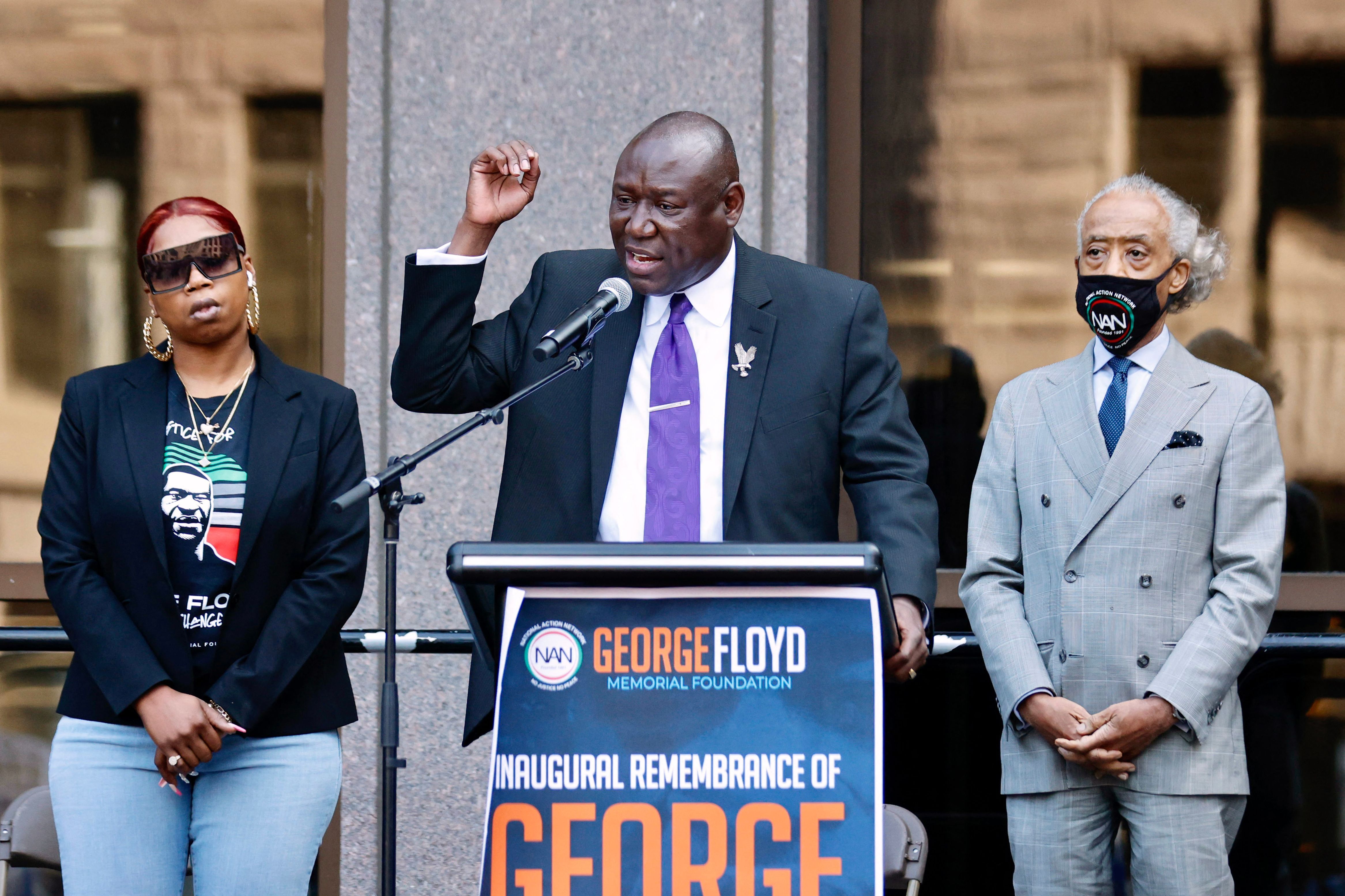 Attorney Ben Crump (C) speaks, flanked by Rev. Al Sharpton (R) and George Floyd's sister Bridgett Floyd, during a remembrance for George Floyd in Minneapolis, Minnesota, on May 23