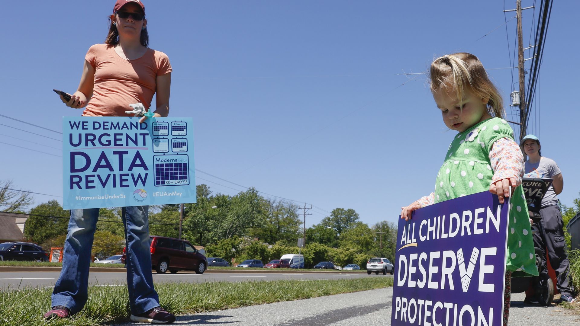 A child is seen with a sign during a demonstration.
