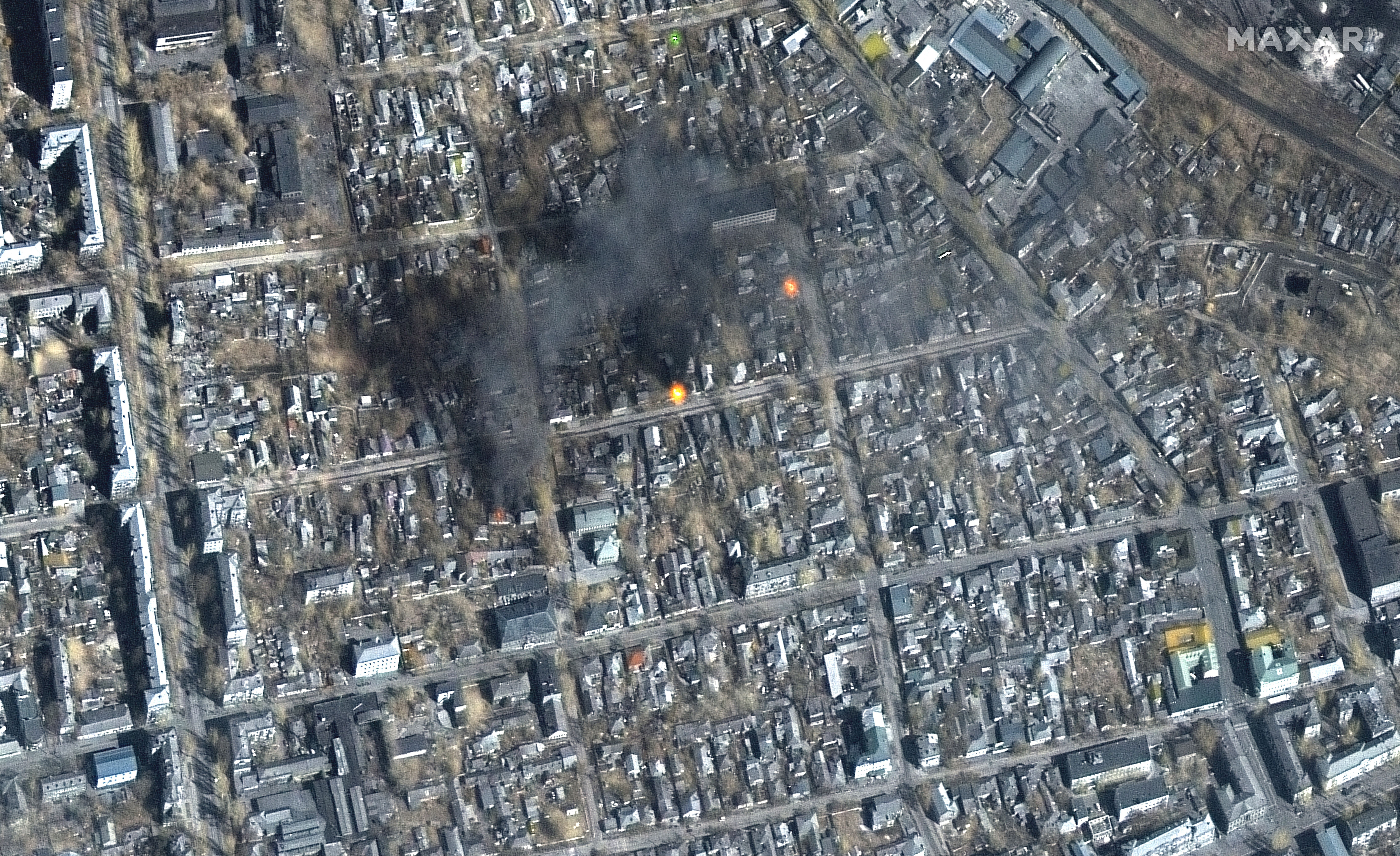 A satellite image of the building damage and fires burning near Primorskyi District, western Mariupol, on March 14.