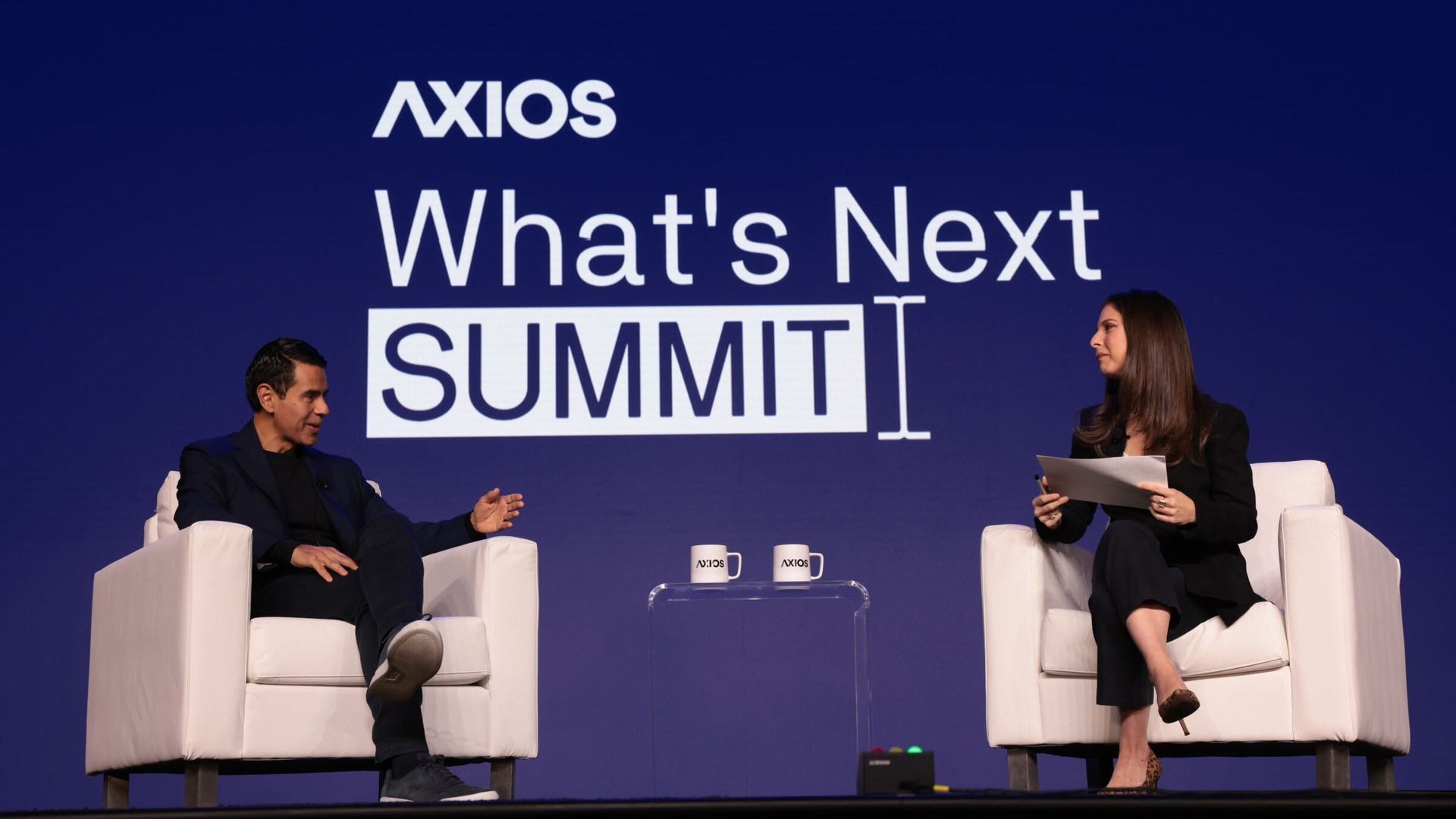 Cesar Conde and Sara Fischer at Axios' What's Next Summit