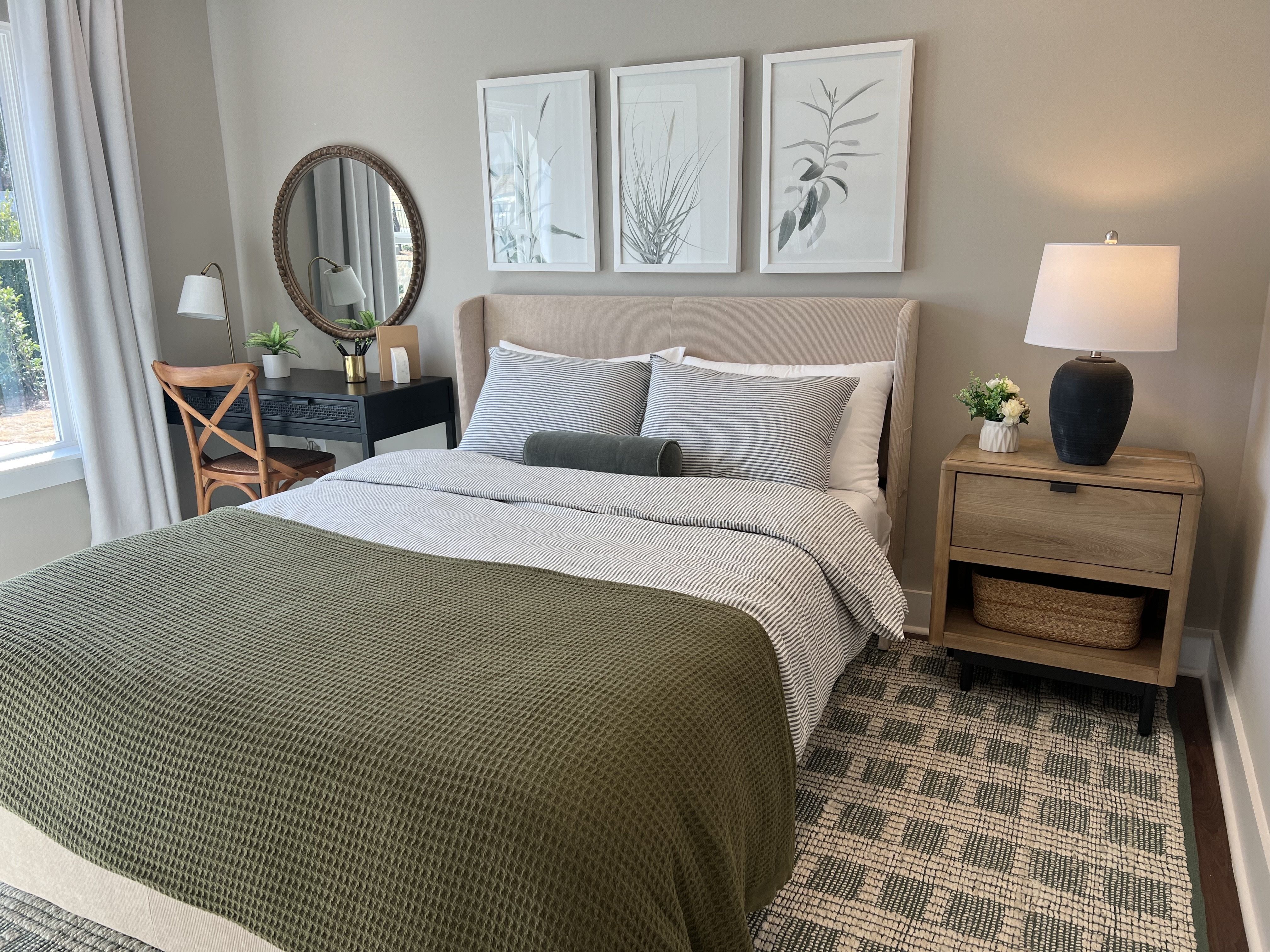 primary suite with green and neutral colors