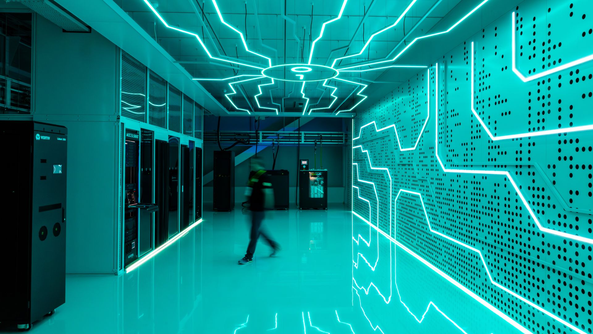 Rows of liquid-cooled computer servers and cooling equipment inside a Global Switch data center in London.