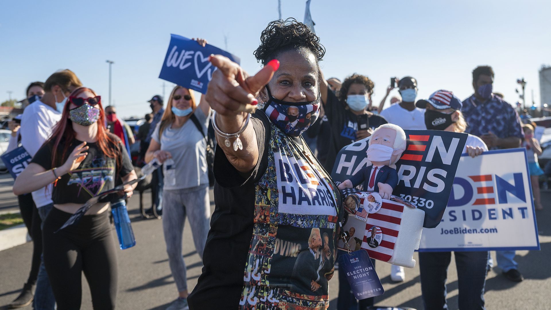 Supporter Faith Green holds a stuffed toy of President-elect Joe Biden as she and others celebrate his victory in the 2020 presidential election outside the Chase Center in Wilmington, Delaware. 