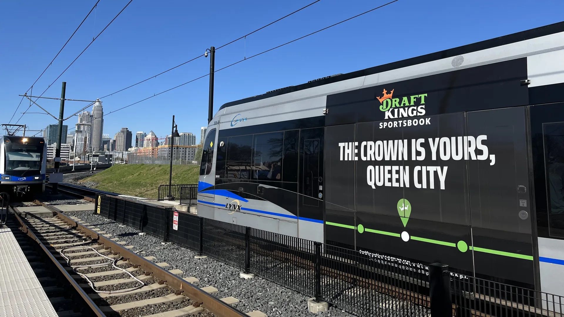 Light Rail with a Draft Kings ad moves toward Uptown Charlotte.
