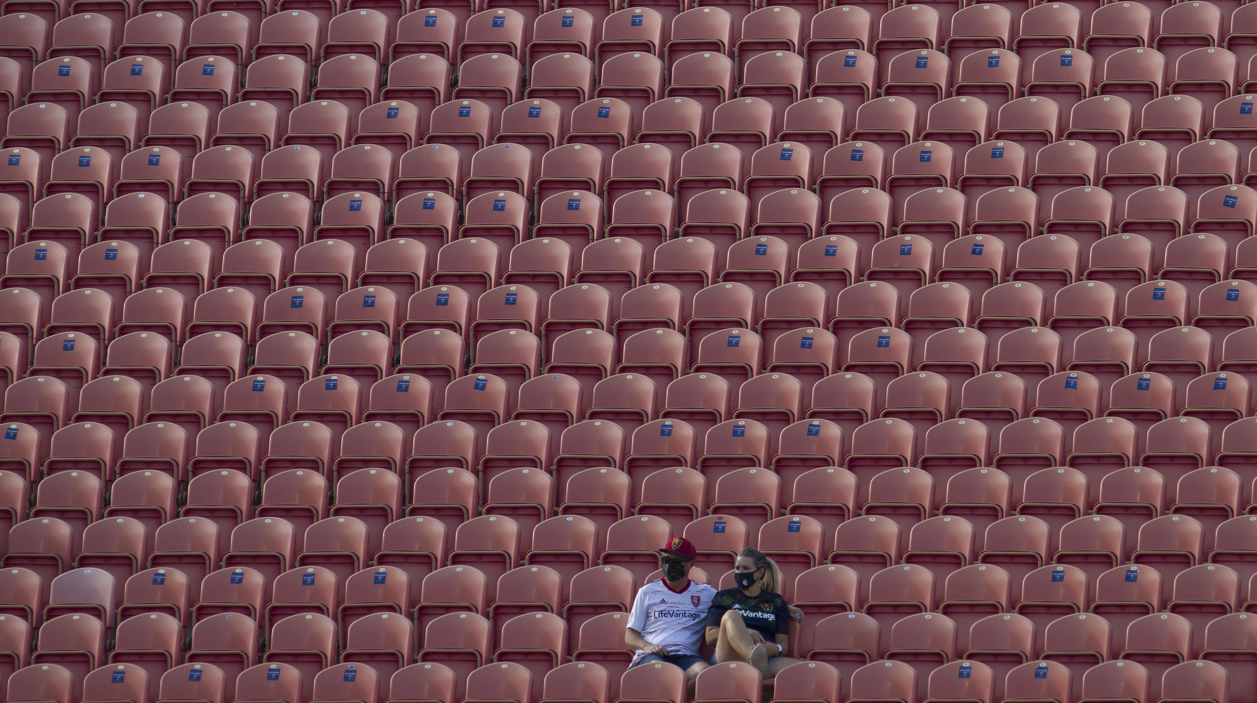 Fans sit in empty stands