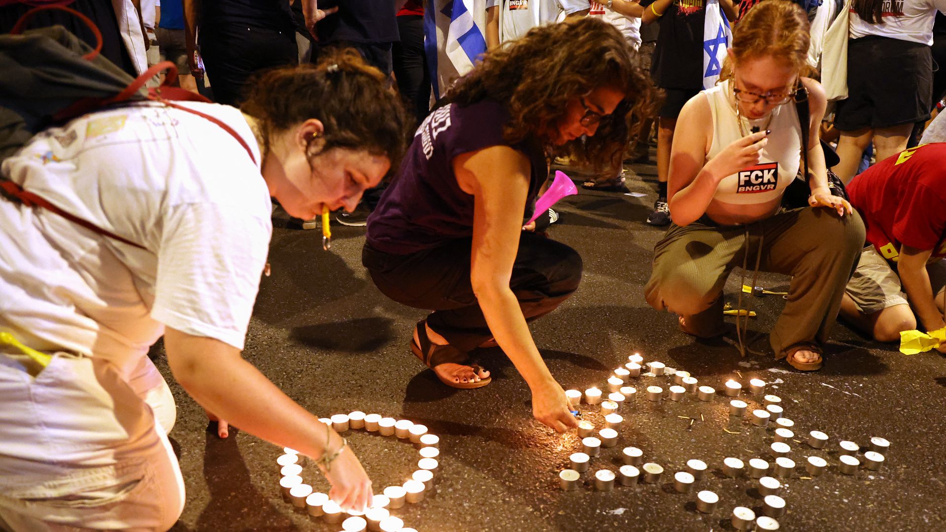 Demonstrators light candles during an anti-government protest calling for action to secure the release of Israeli hostages held captive since the Oct. 7 attacks in Tel Aviv on Sept. 3, 2024