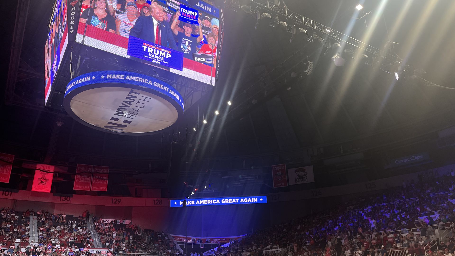 Donald Trump on jumbotron at packed arena
