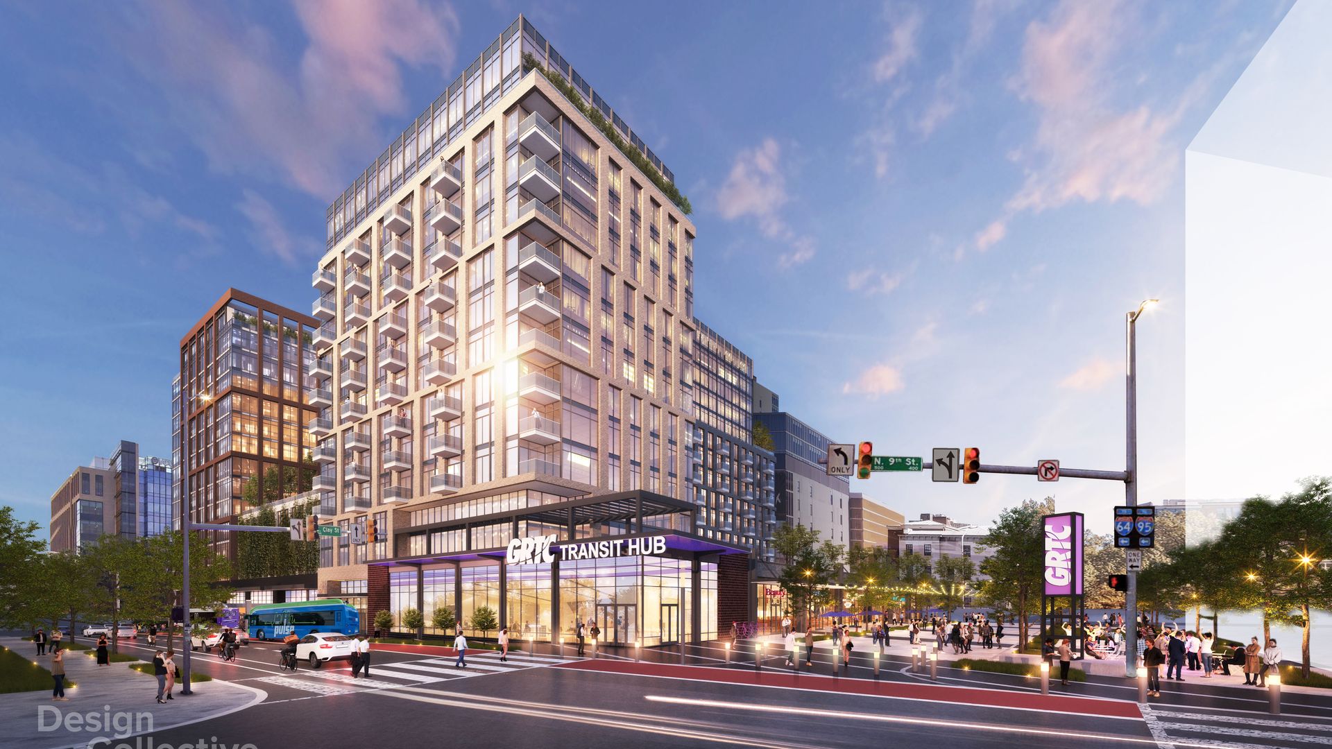 Modern brick-and-glass high-rise with many balconies beside a transit hub. Busy city street with pedestrians, a blue bus, crosswalks, and street signs beneath a clear blue sky.