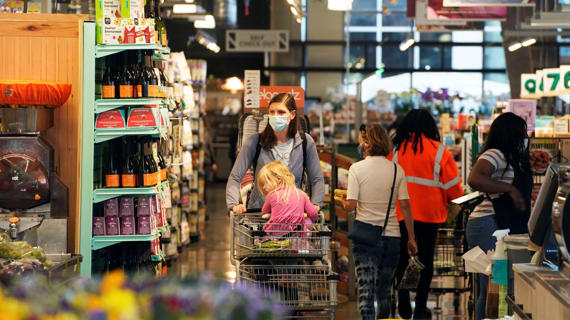 Grocery shoppers are seen in Washington. D.C., last month.