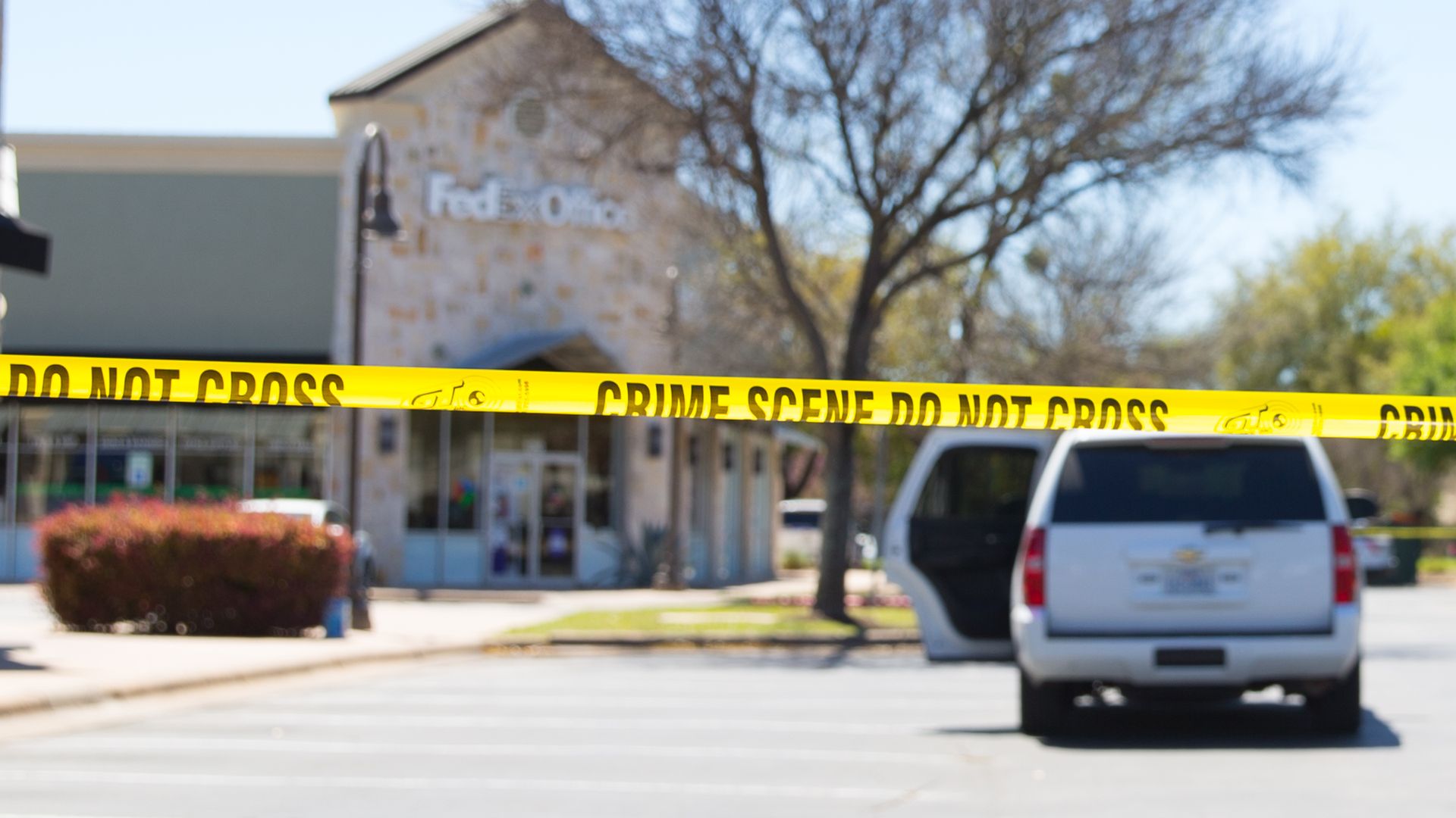 Police and FBI Agents investigate at the Sunset Valley FedEx store in Austin, Texas, which is linked to the package bomb.