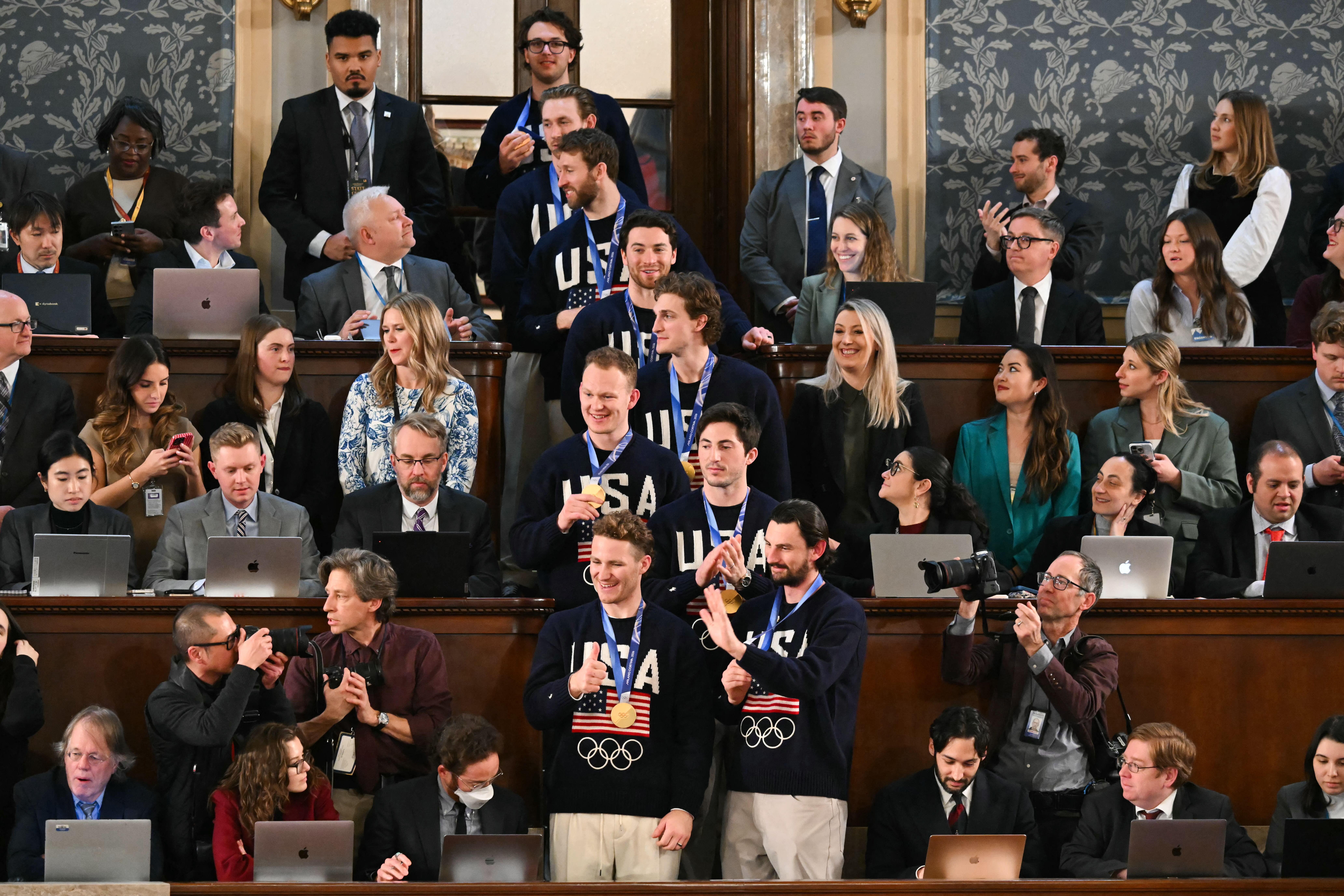 Members of the US Men's Olympic hockey team are recogized by US President Donald Trump as he delivers the State of the Union address in the House Chamber of the US Capitol in Washington, DC, on February 24, 2026. (Photo by ANDREW CABALLERO-REYNOLDS / AFP via Getty Images)