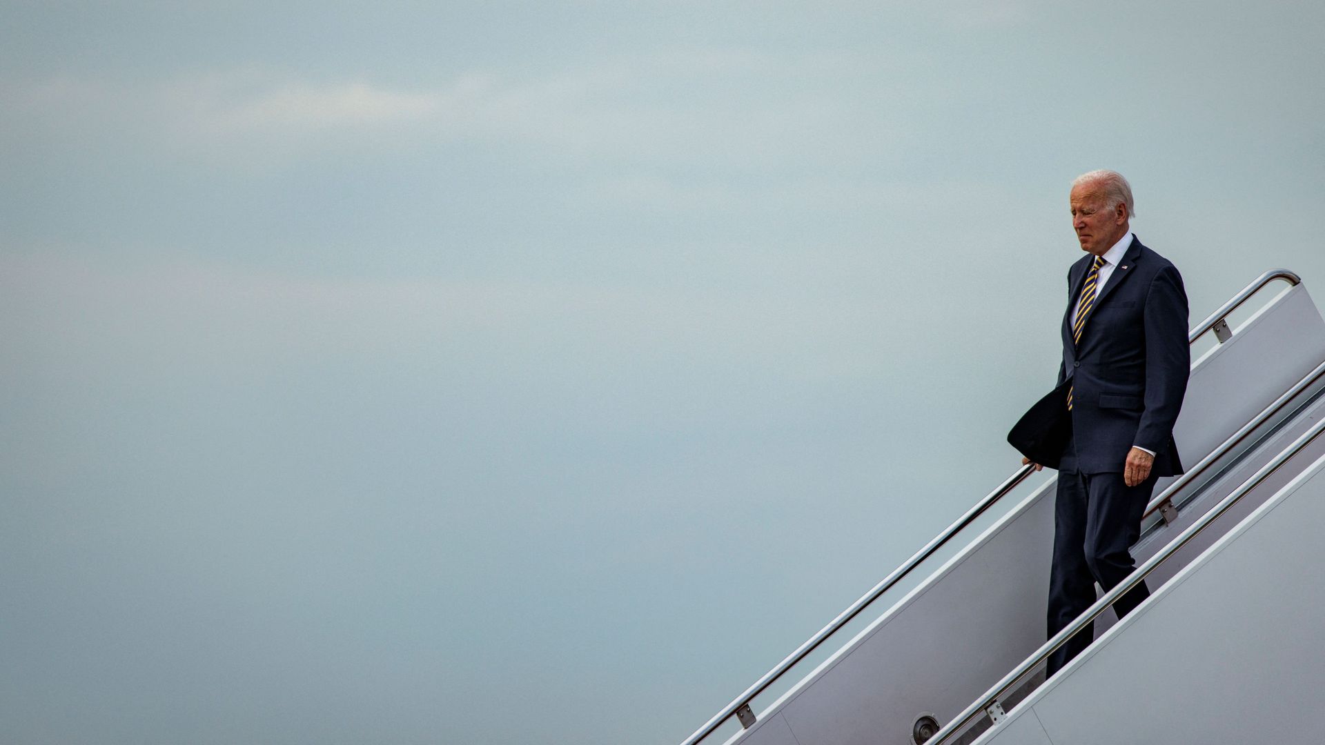 Biden walks down steps from Air Force One