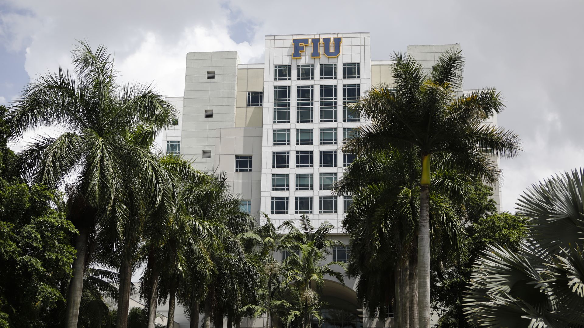 A tall building with FIU letters at the top.