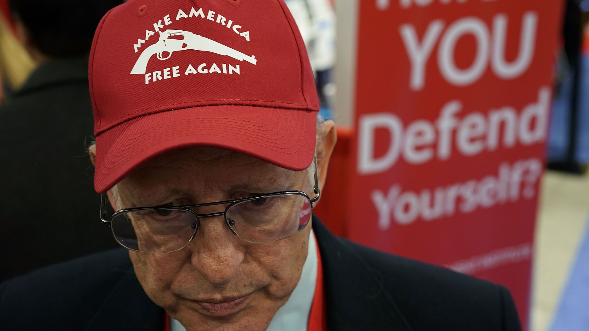 Dick Heller wearing a hat that says "Make America Free Again." 