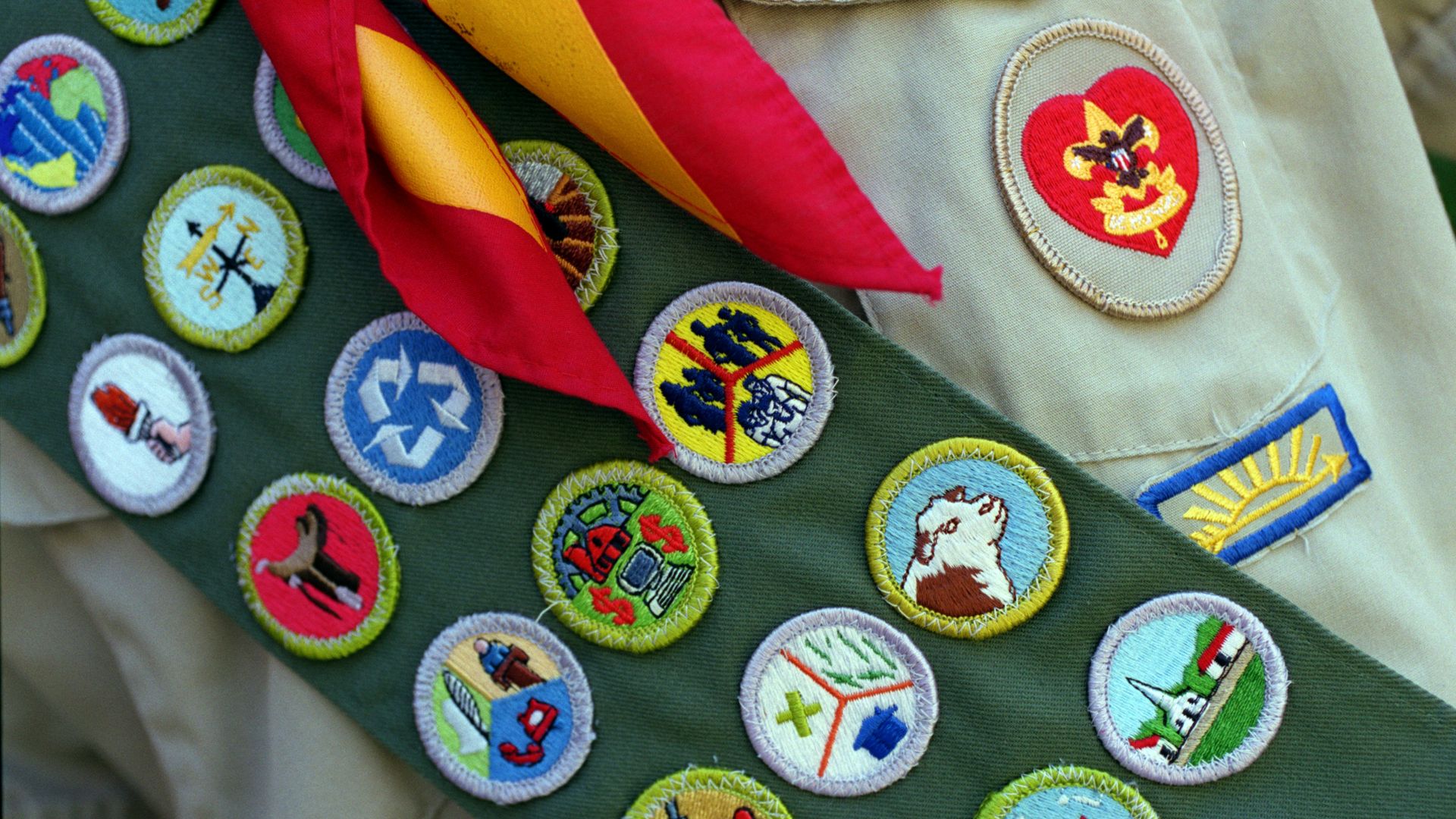 An image of a sash with several merit badges on it 