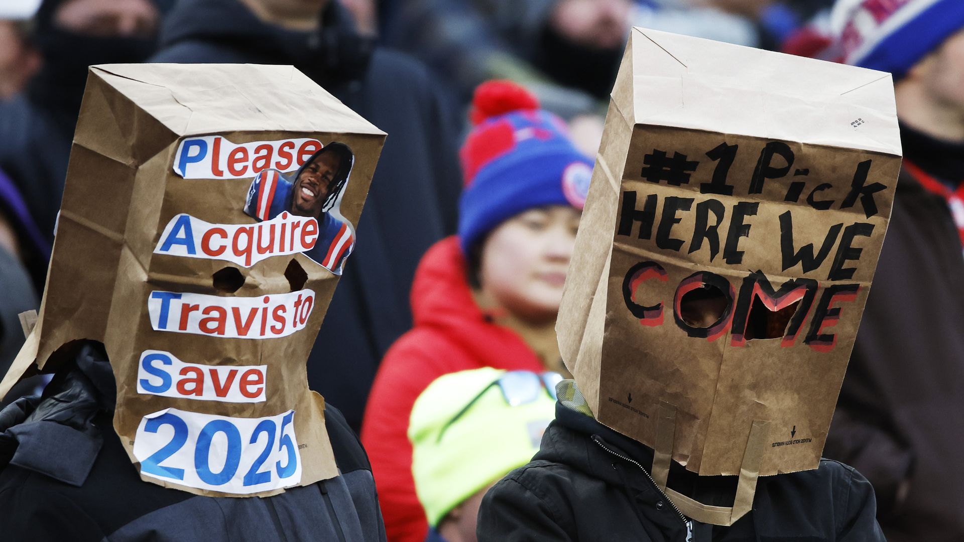 fans with bags over heads