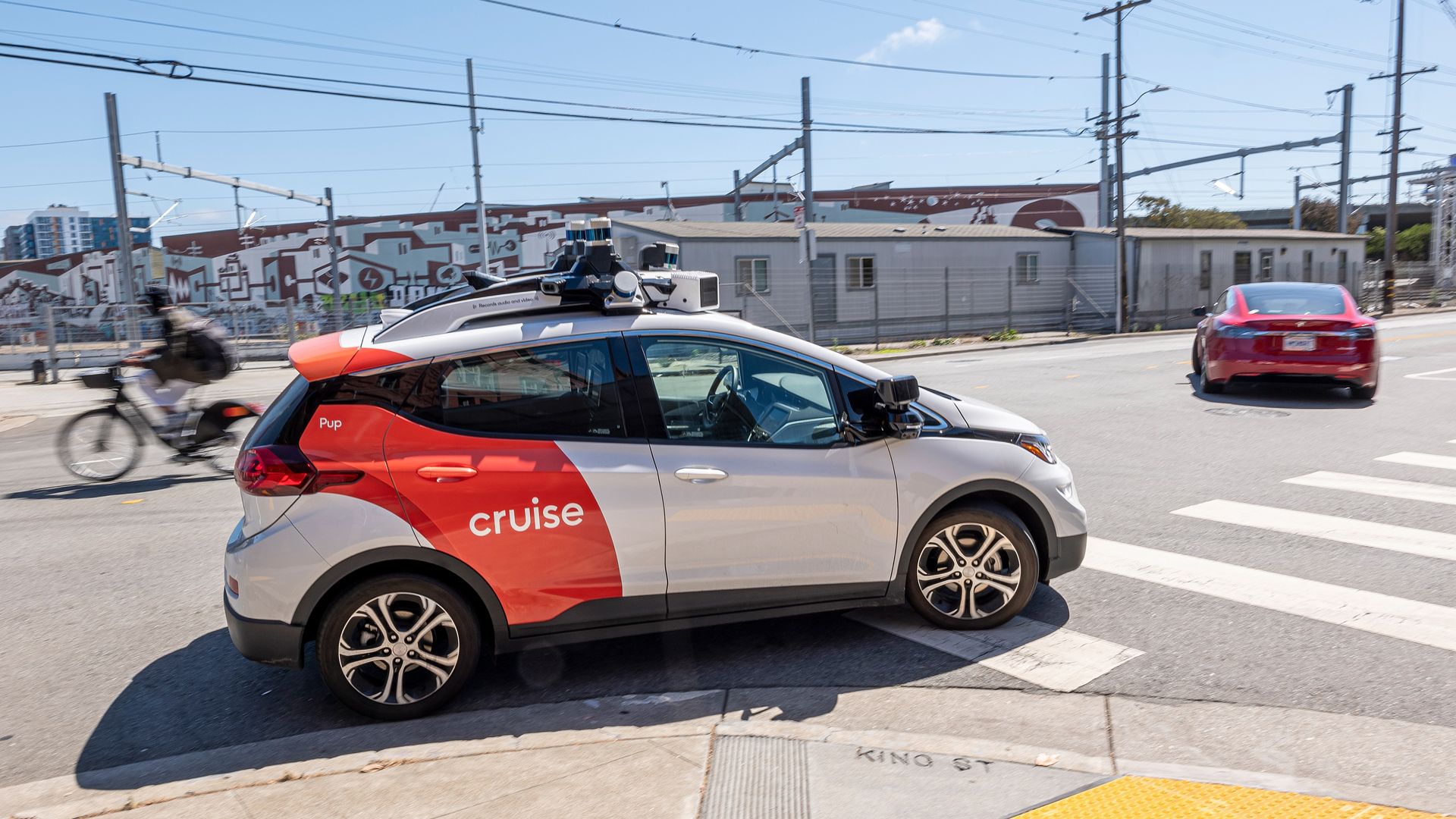 Small car that says Cruise on the side