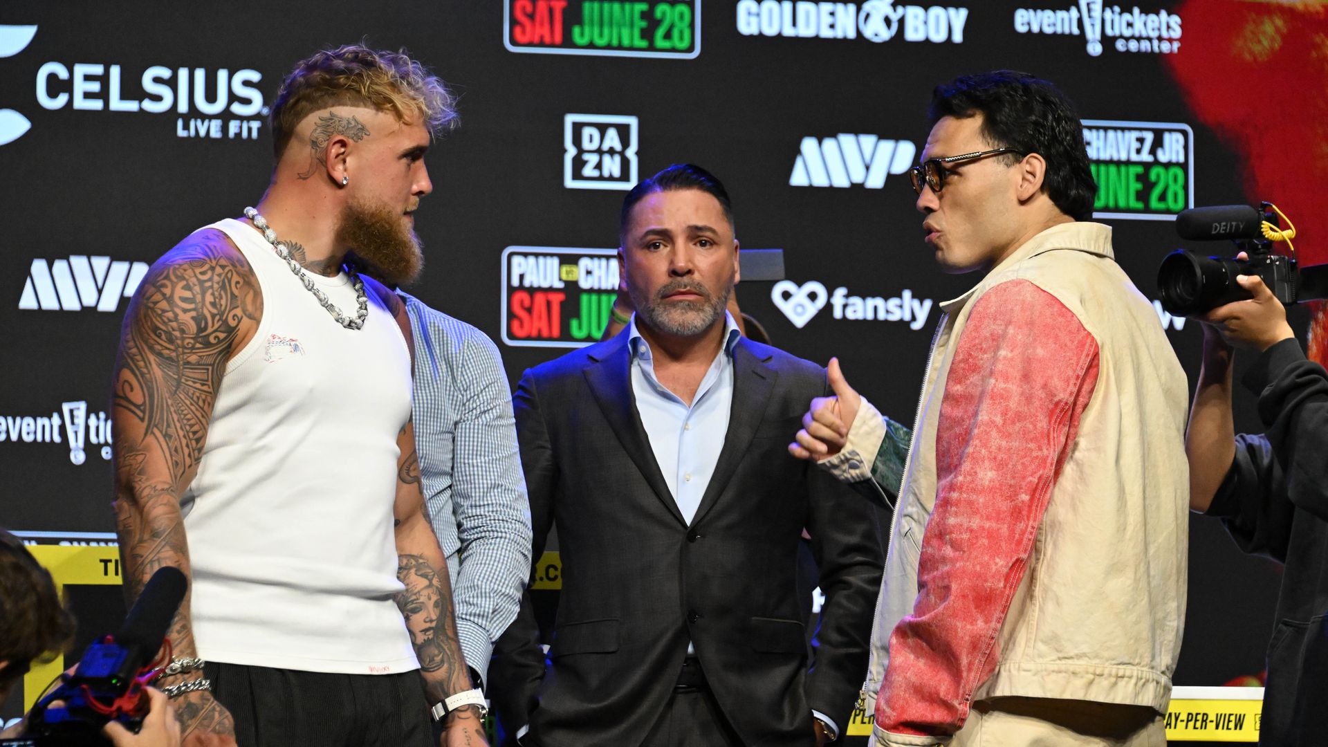 Jake Paul, left, gestures towards Julio Cesar Chavez Jr., Mexico's former world champion, during a boxing news conference.