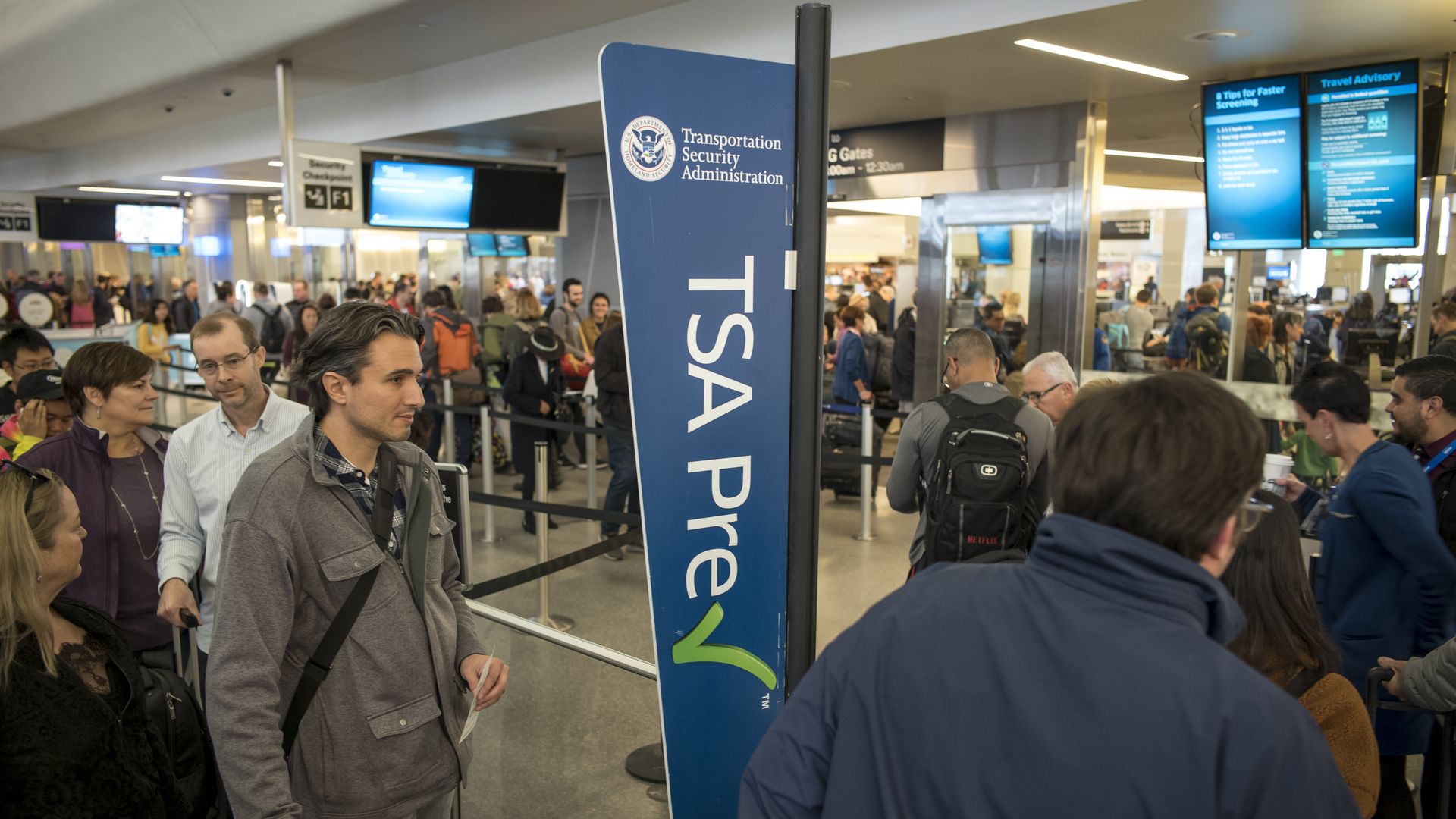 Image of people waiting in the TSA PreCheck line at San Francisco airport. 