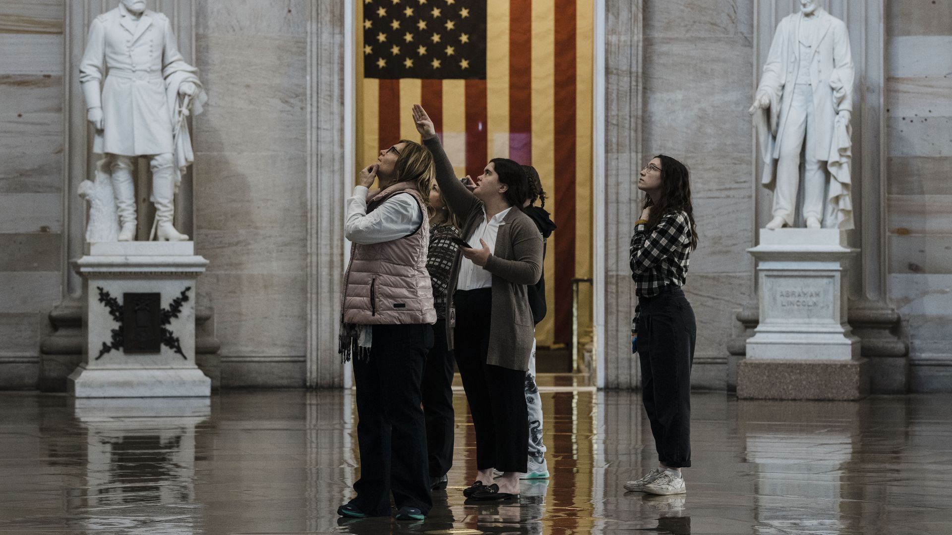 A group of tourists is seen in the U.S. Capitol Rotunda.